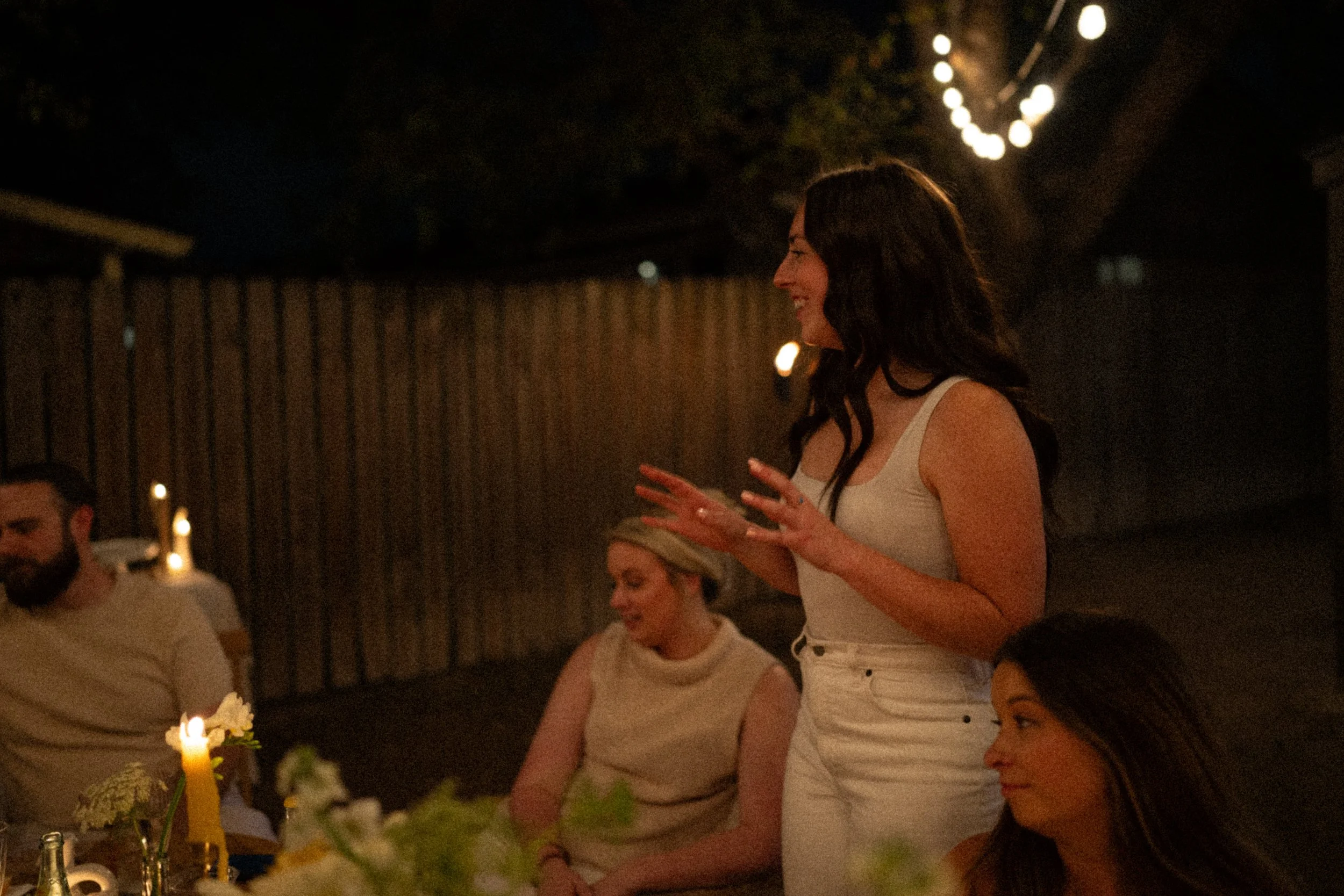 Austin wedding photographer capturing heartfelt speeches at engagement party