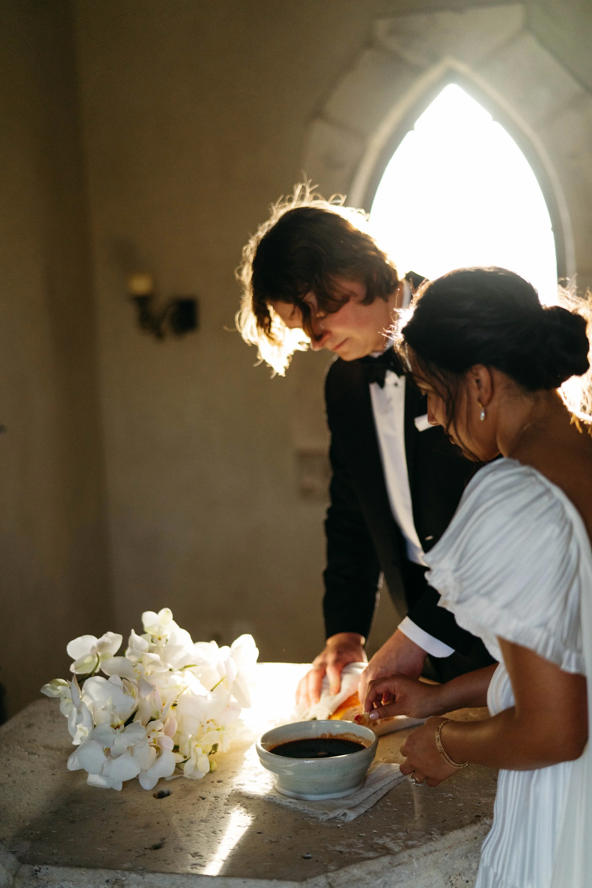 Communion shared by bride, groom, and wedding party | candid Austin wedding photography in Houston.