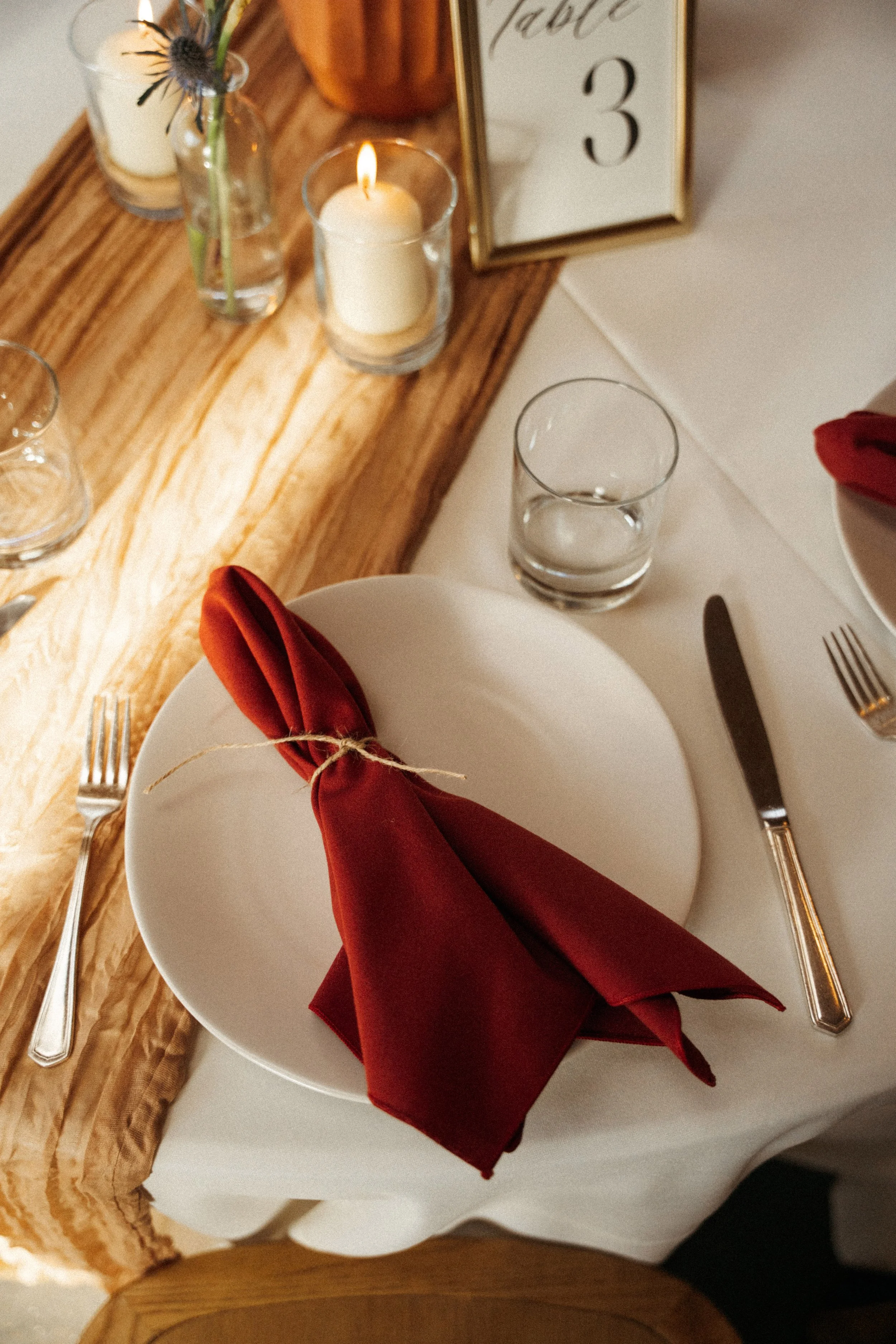 place settings and candles at The Grand Lady wedding reception hall