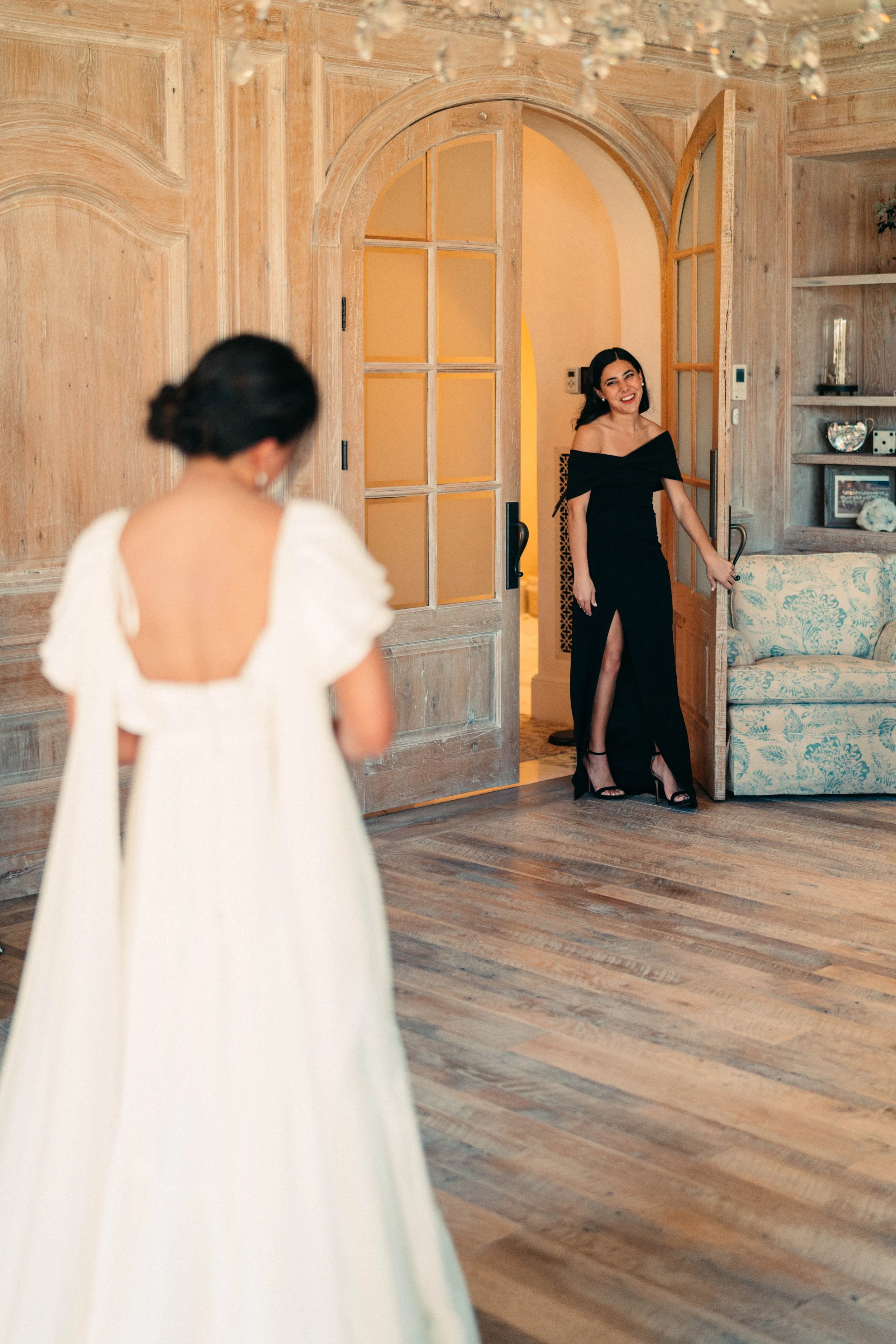 Bride sharing first look with bridesmaids in classic bridesmaids dresses at Houston Oaks Country Club and Retreat