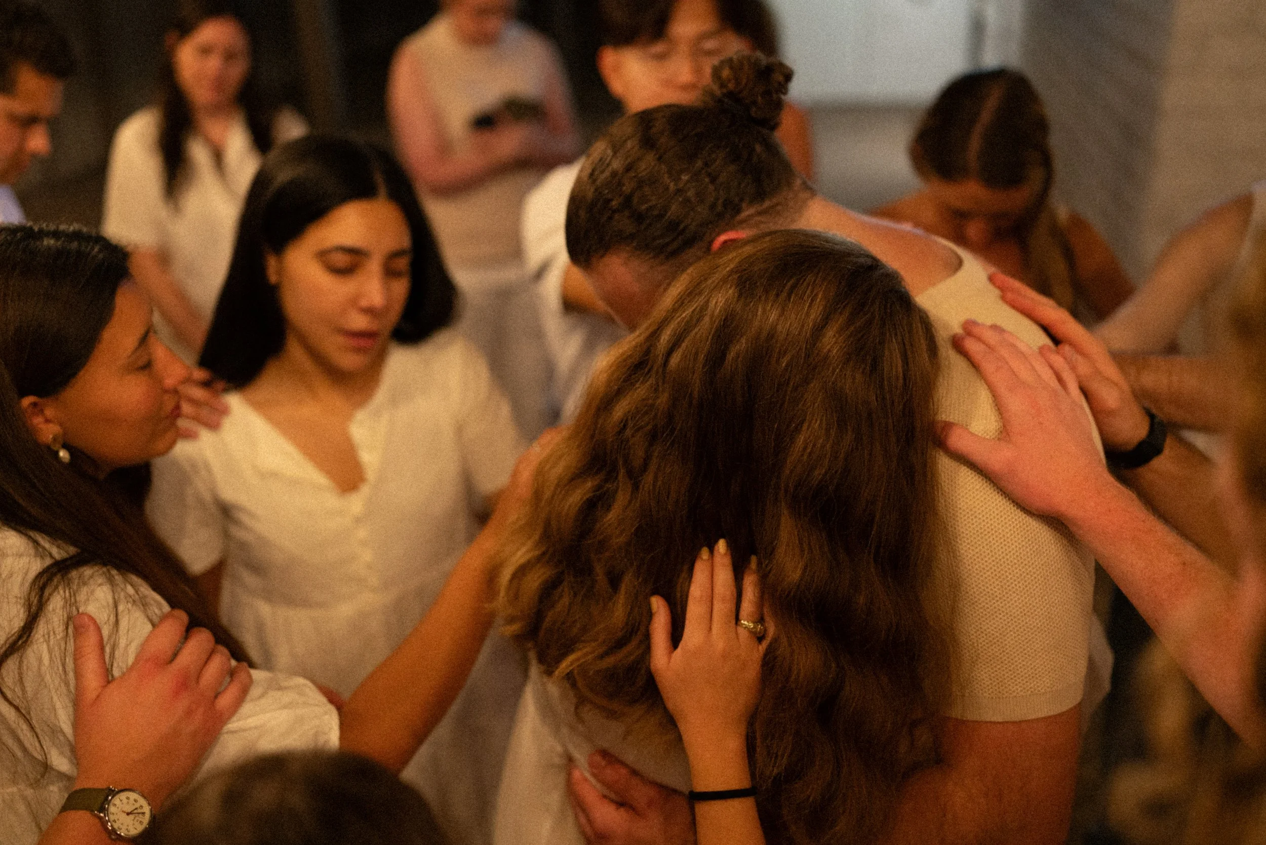 Documentary style wedding photography of couple celebrating engagement with loved ones
