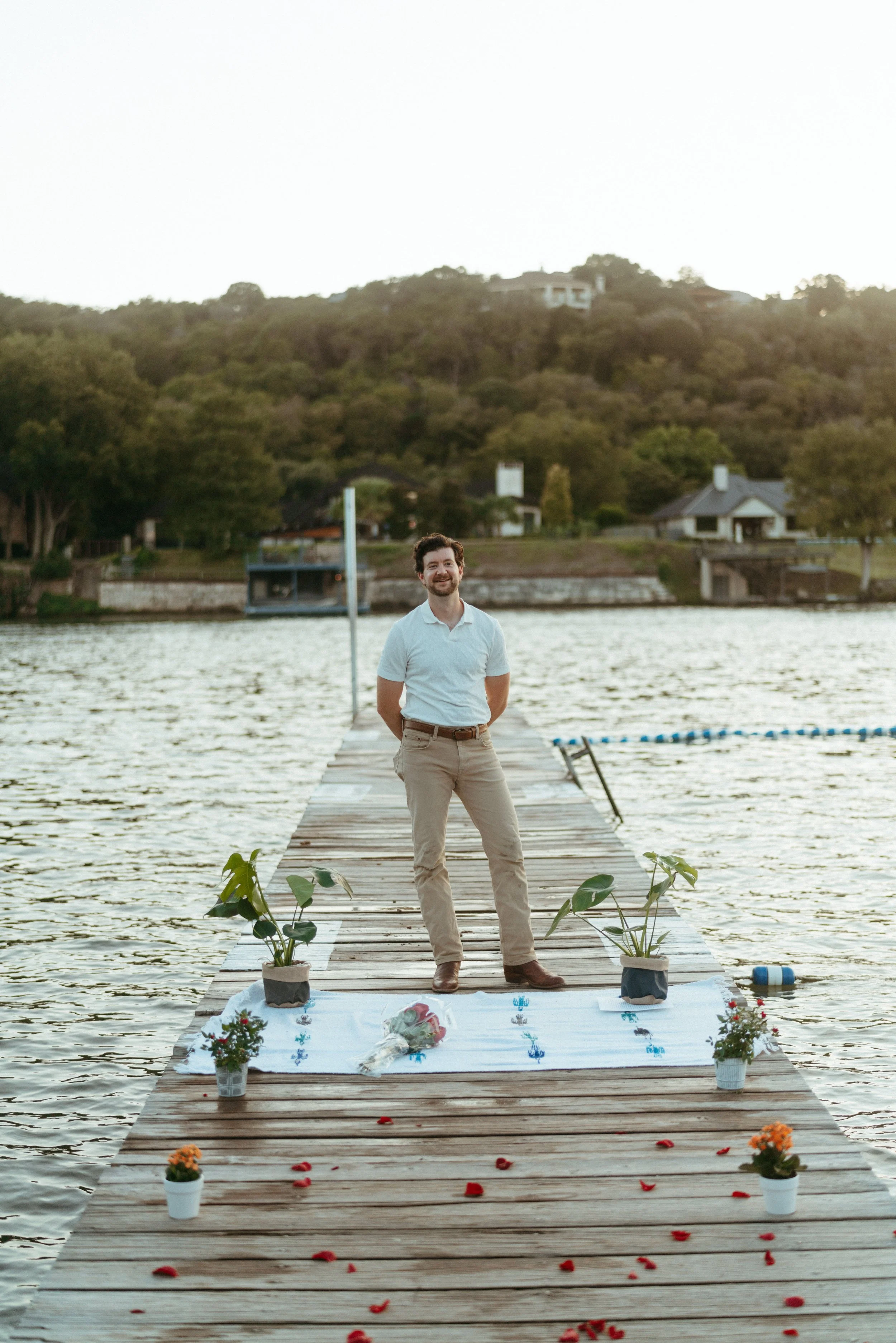 Romantic dockside proposal portraits by Austin wedding photographer at sunset