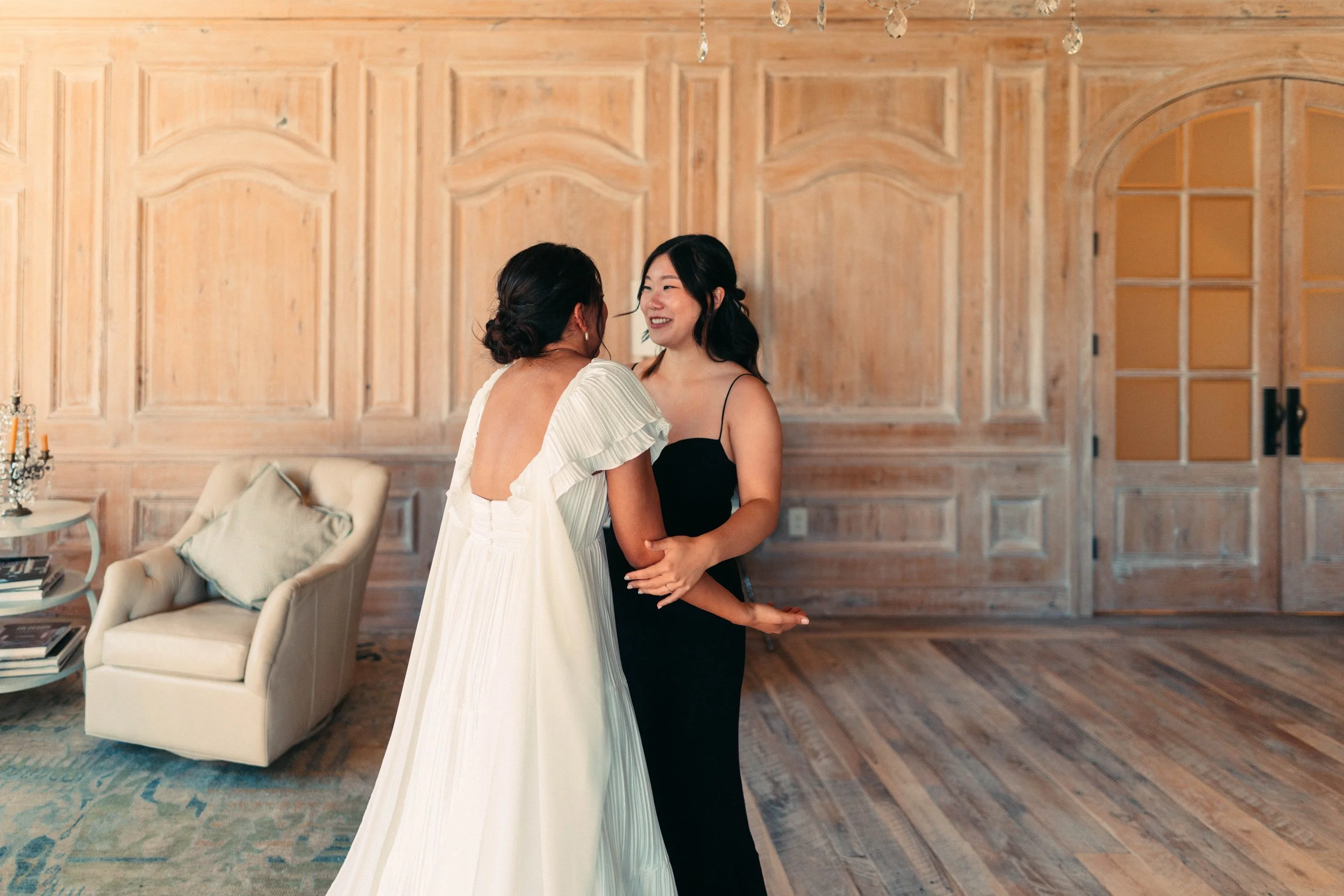 Bride sharing an emotional first look with her bridesmaids at Houston Oaks | documentary Austin travel wedding photographer.