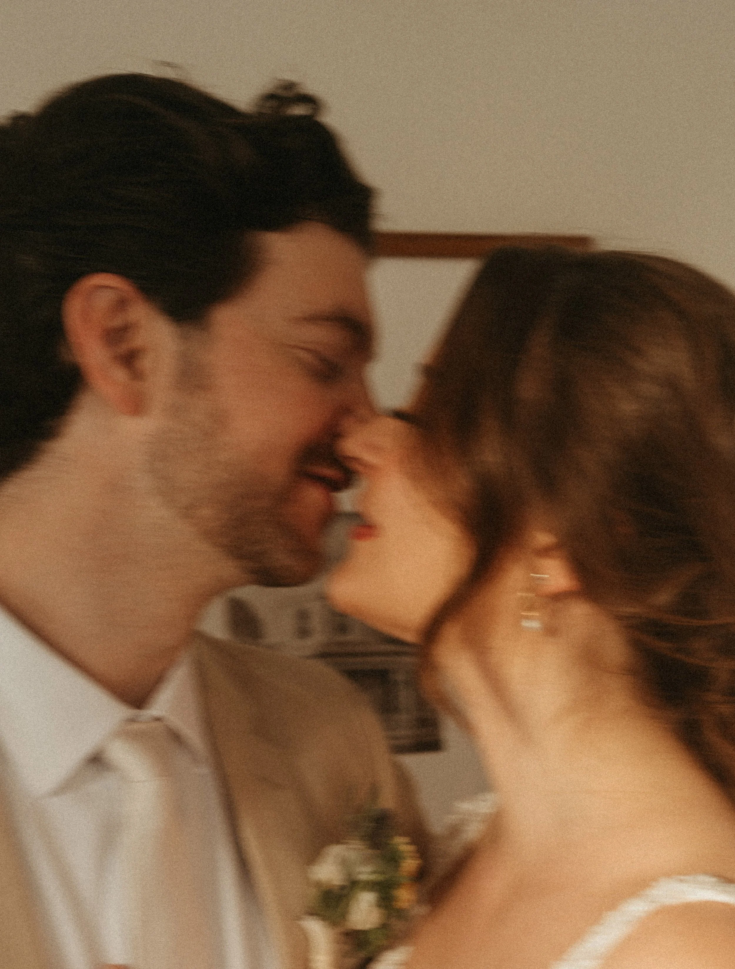 Bride and groom sunset session candid in The Grand Lady historic mansion