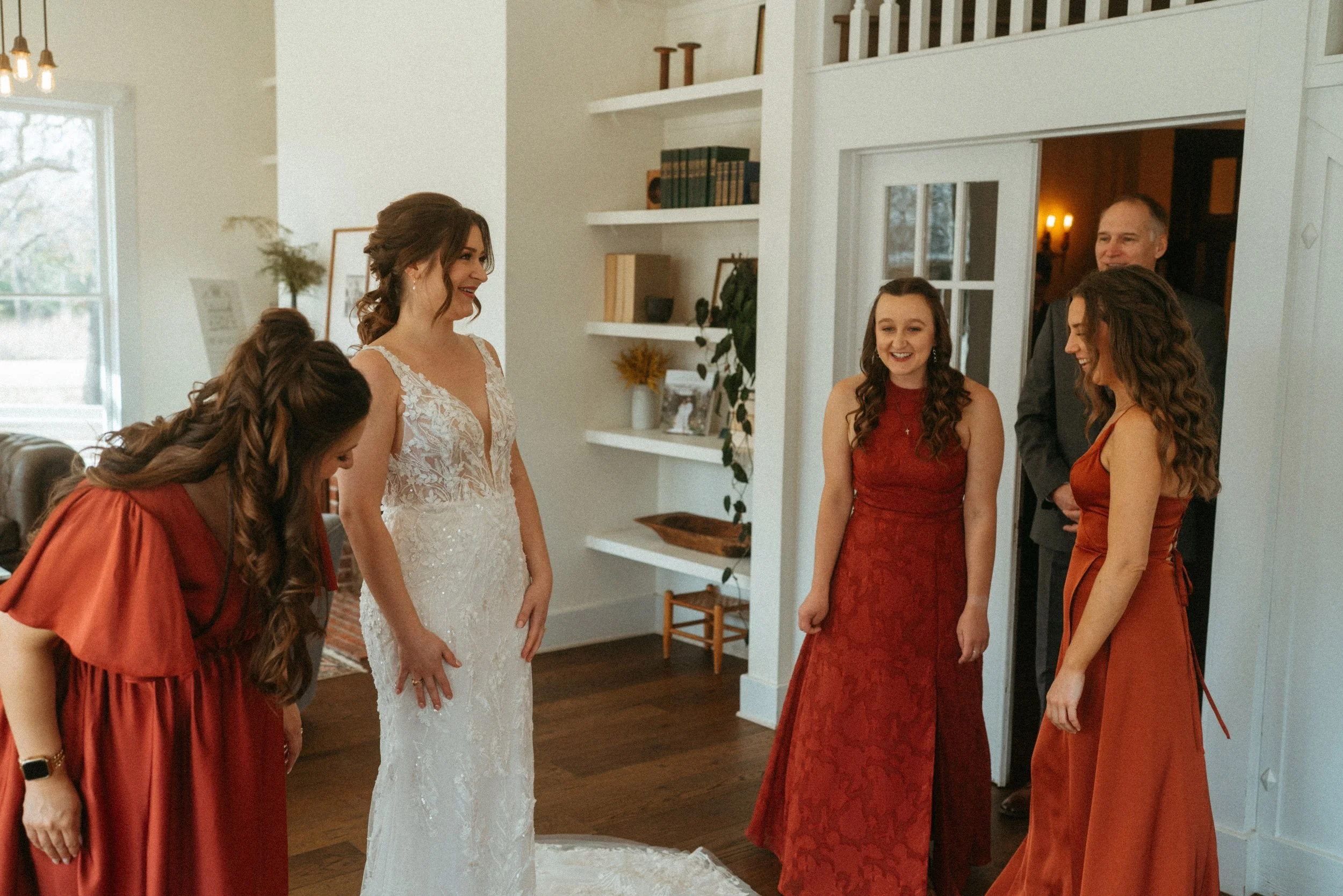 candid of the first look between the bride and her bridesmaids at The Grand Lady in manor tx just outside of austin