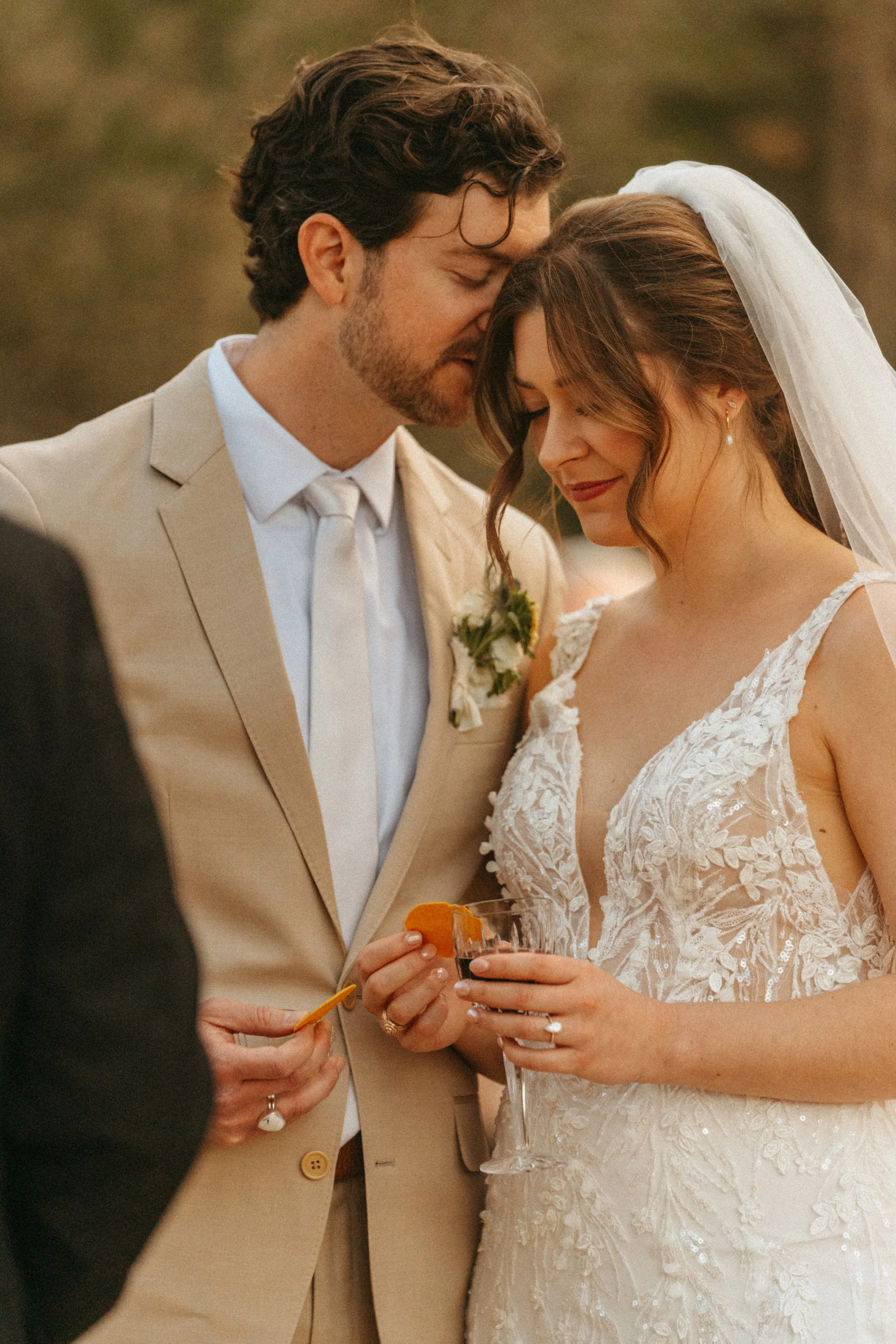Bride and groom exchange vows under the pergola in The Grand Lady flower garden in Manor, TX