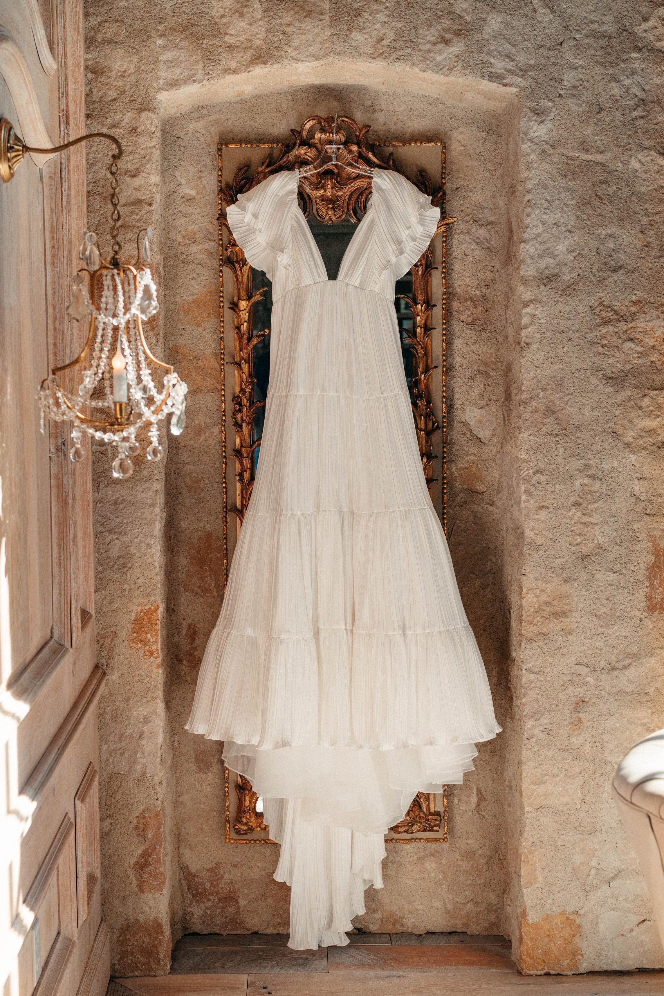 elegant wedding gown hanging at travel venue in houston texas at houston oaks country club