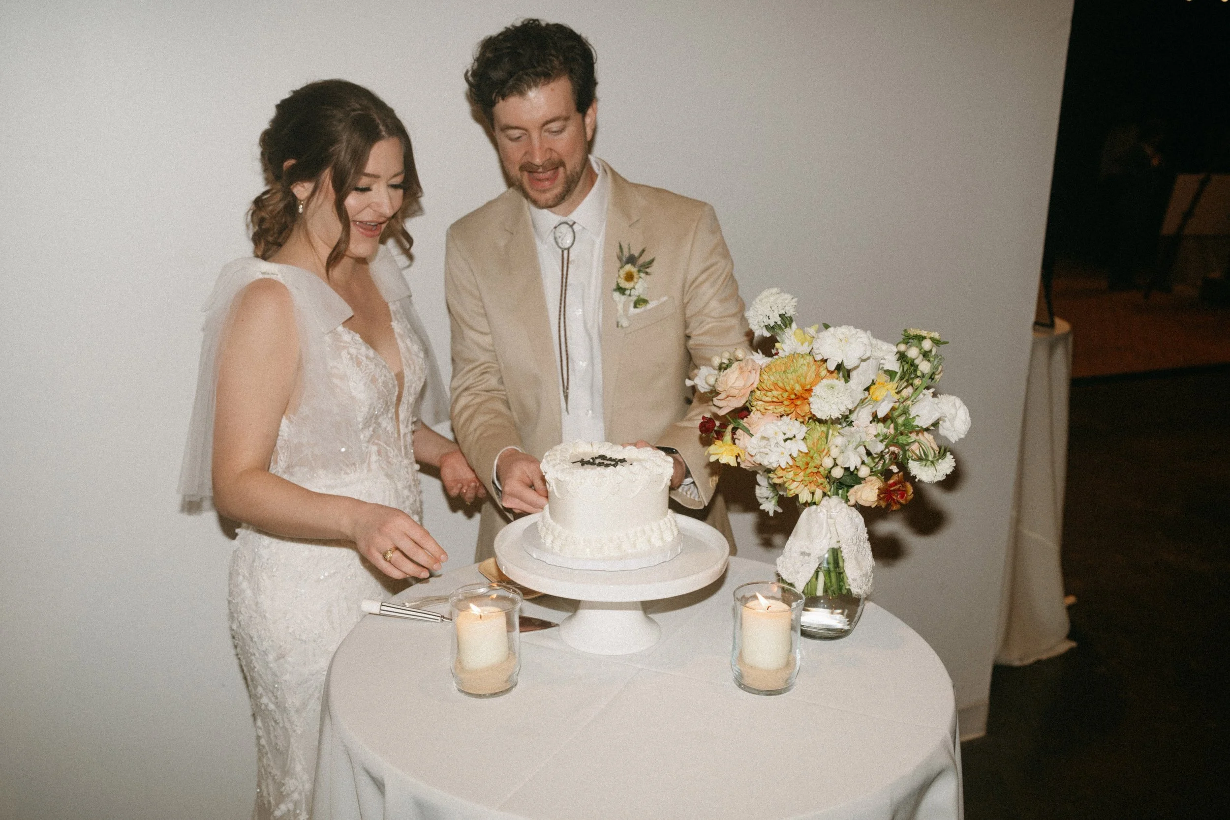 Bride and groom cutting cake at The Grand Lady Austin wedding reception