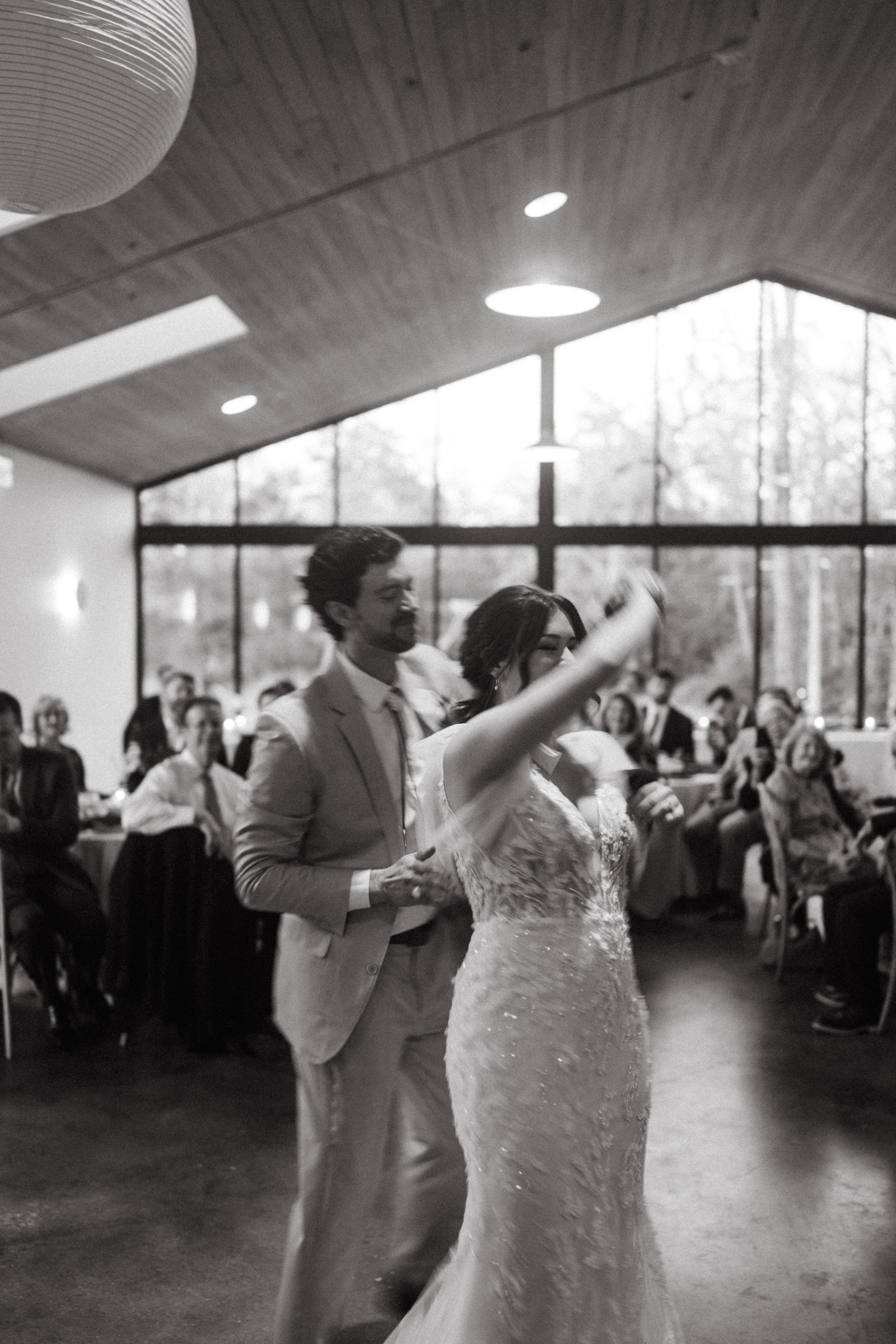 First dance of bride and groom inside The Grand Lady modern reception hall