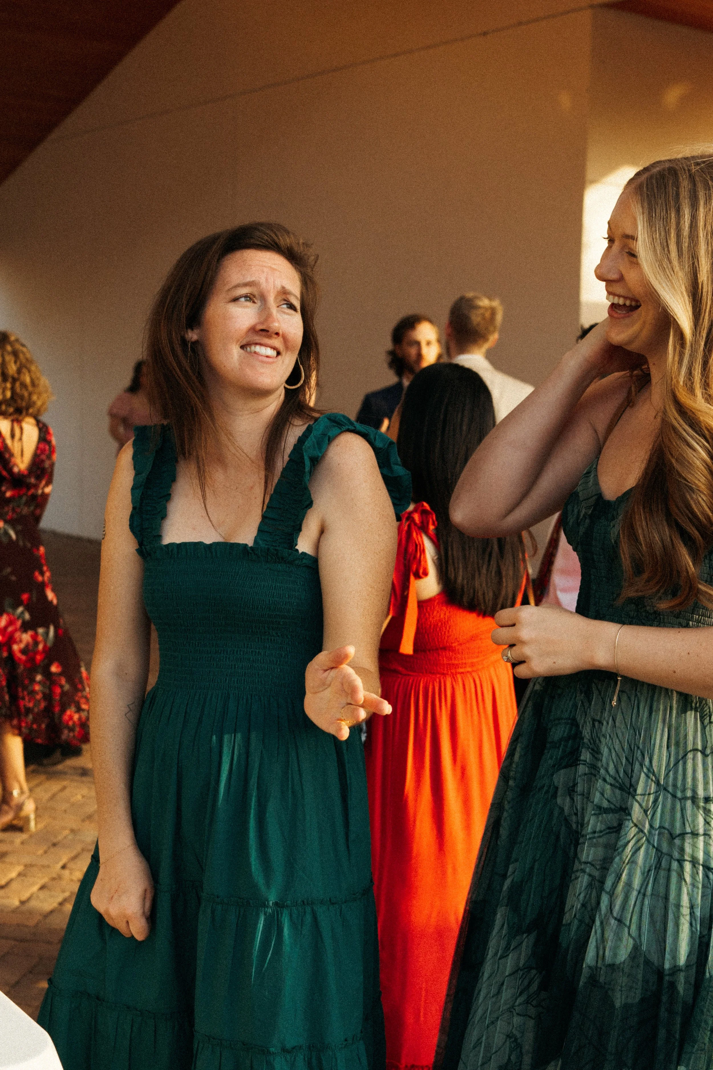 Guests laughing during cocktail hour at The Grand Lady wedding