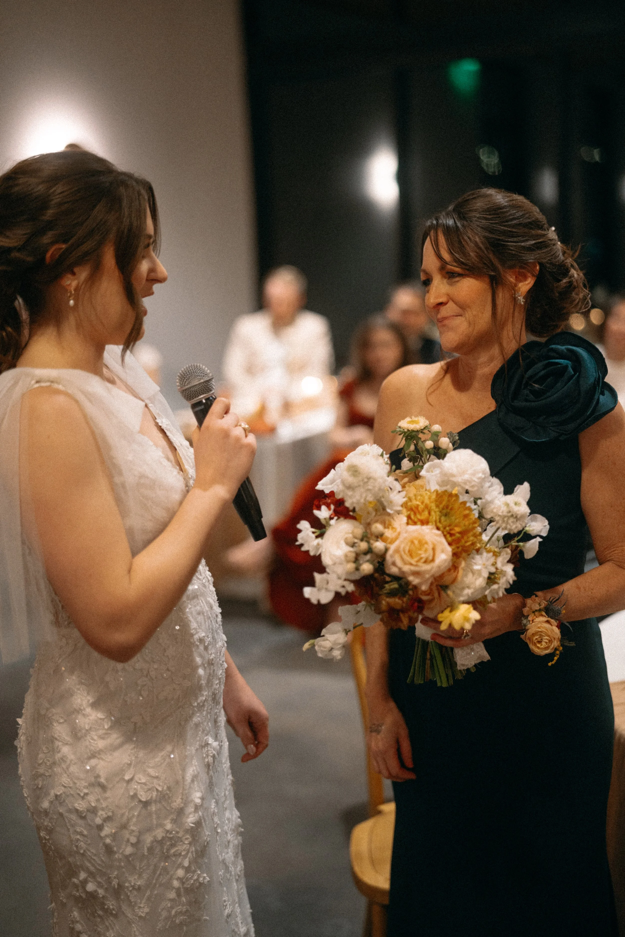 Bride dedicates bouquet to her mother during wedding reception at The Grand Lady Manor TX