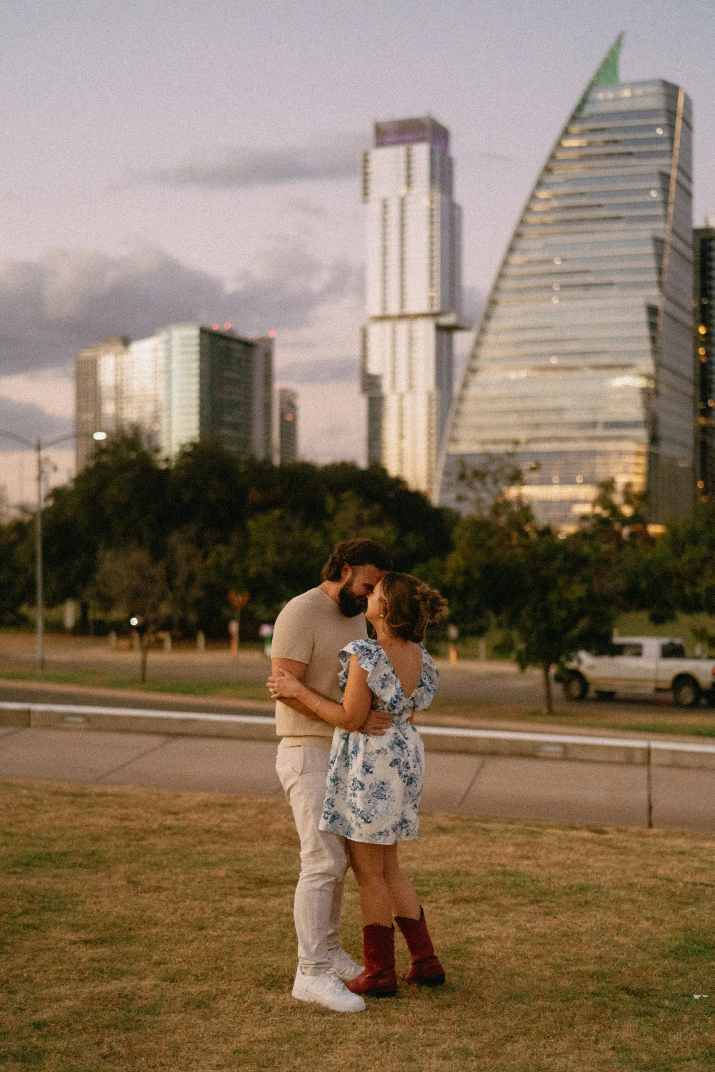 Bride-to-be surprised during proposal at Auditorium Shores with Austin skyline