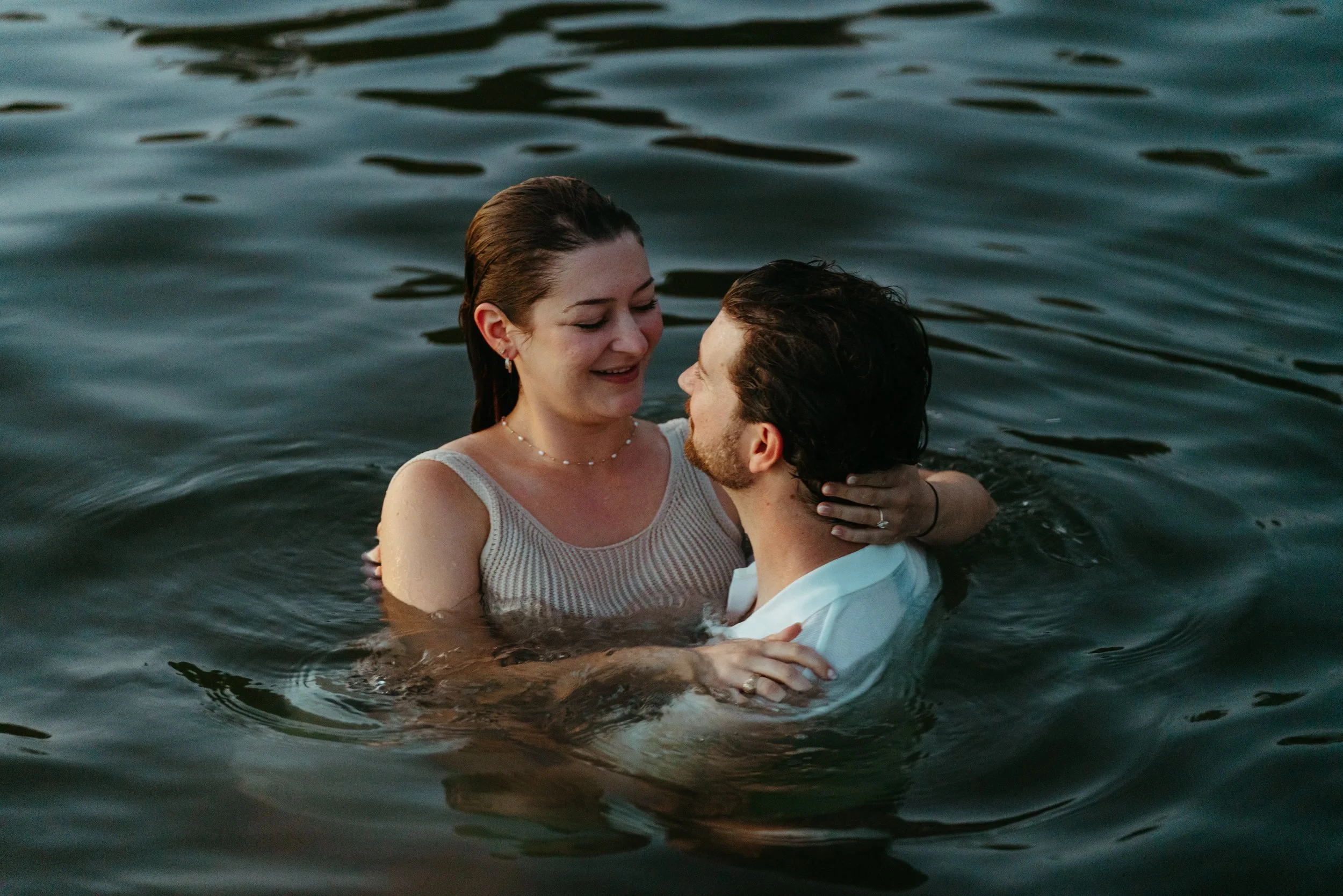 Playful Austin wedding photography with couple celebrating in the water