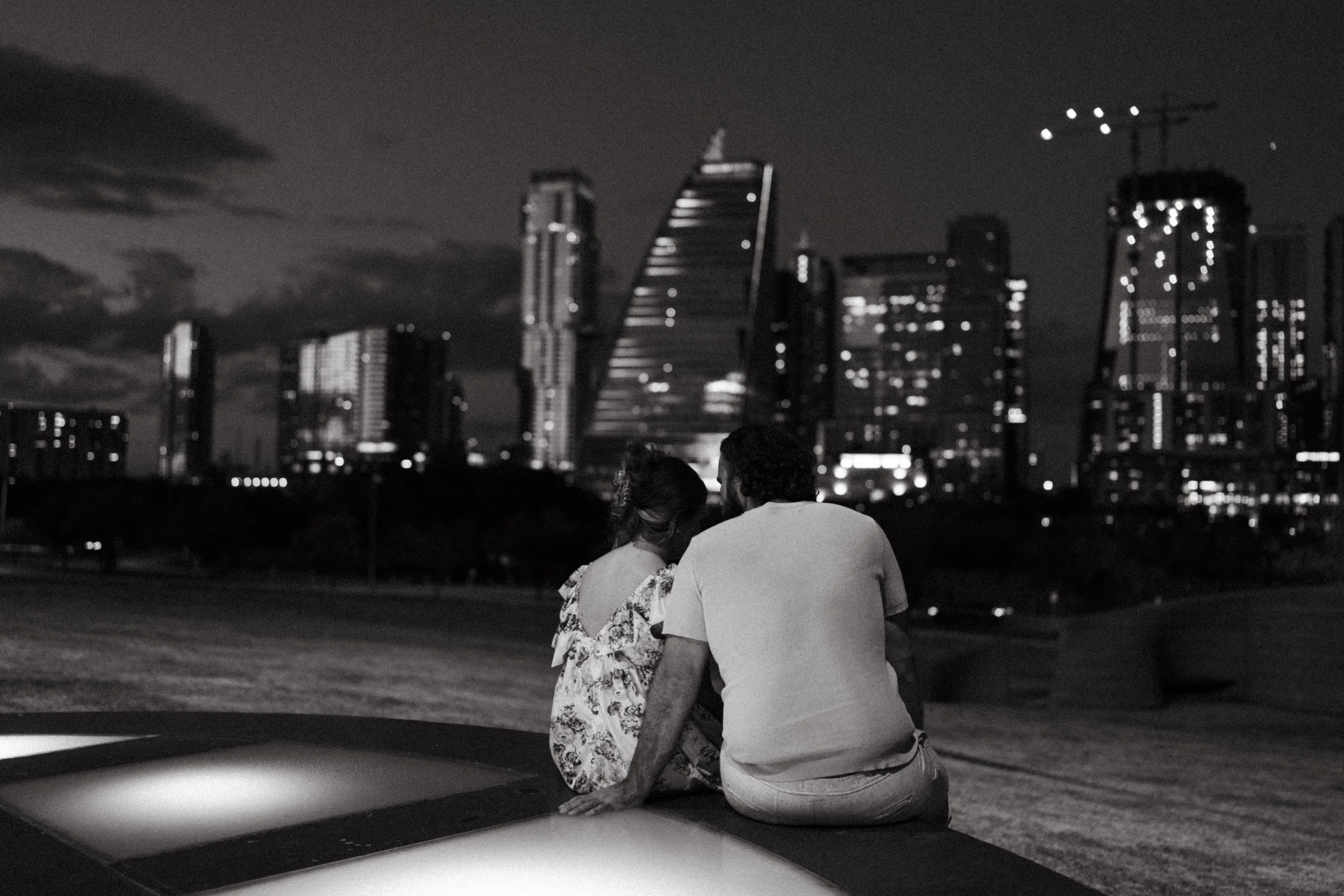 Bride-to-be surprised during proposal at Auditorium Shores with Austin skyline