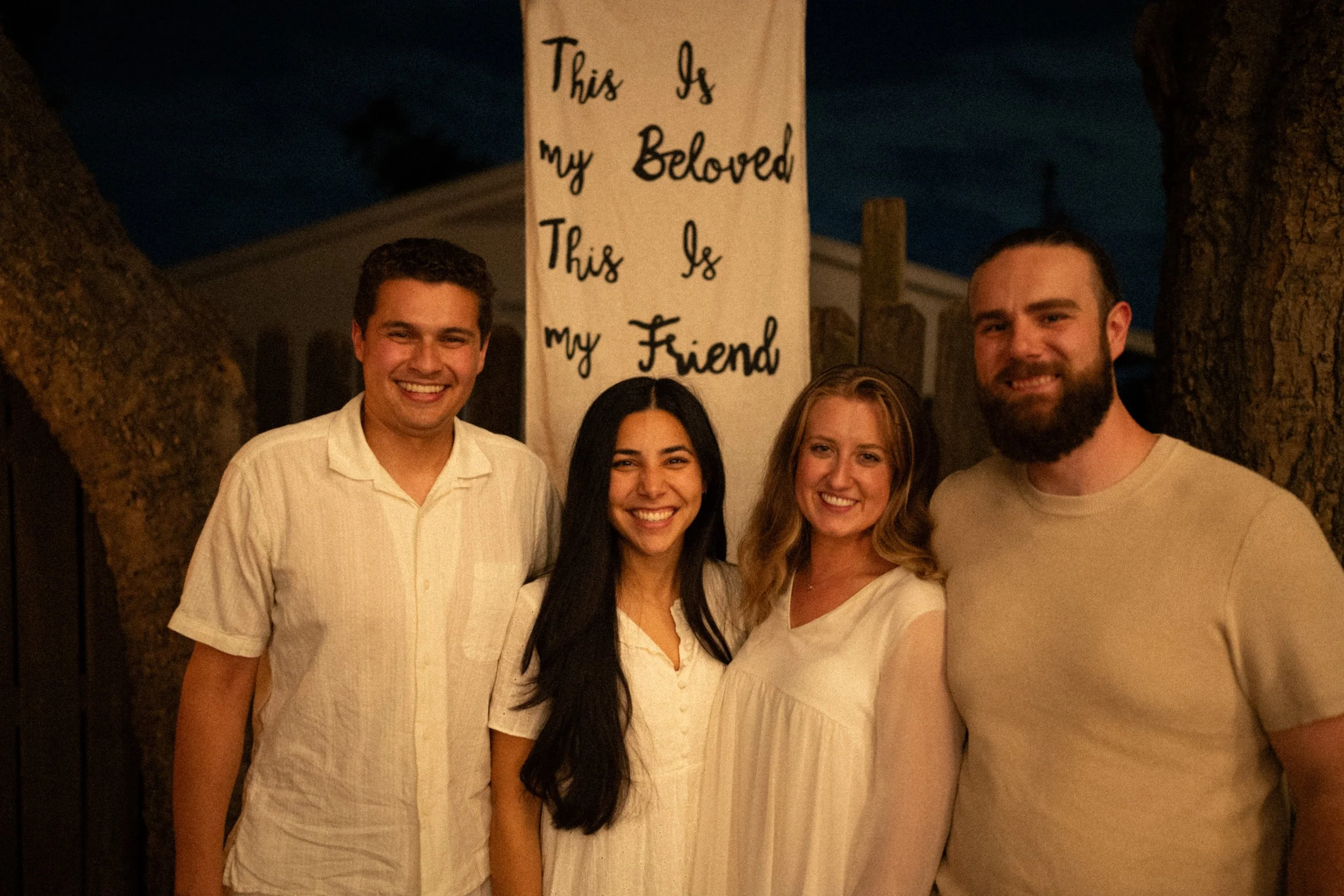Documentary style wedding photography of couple celebrating engagement with loved ones