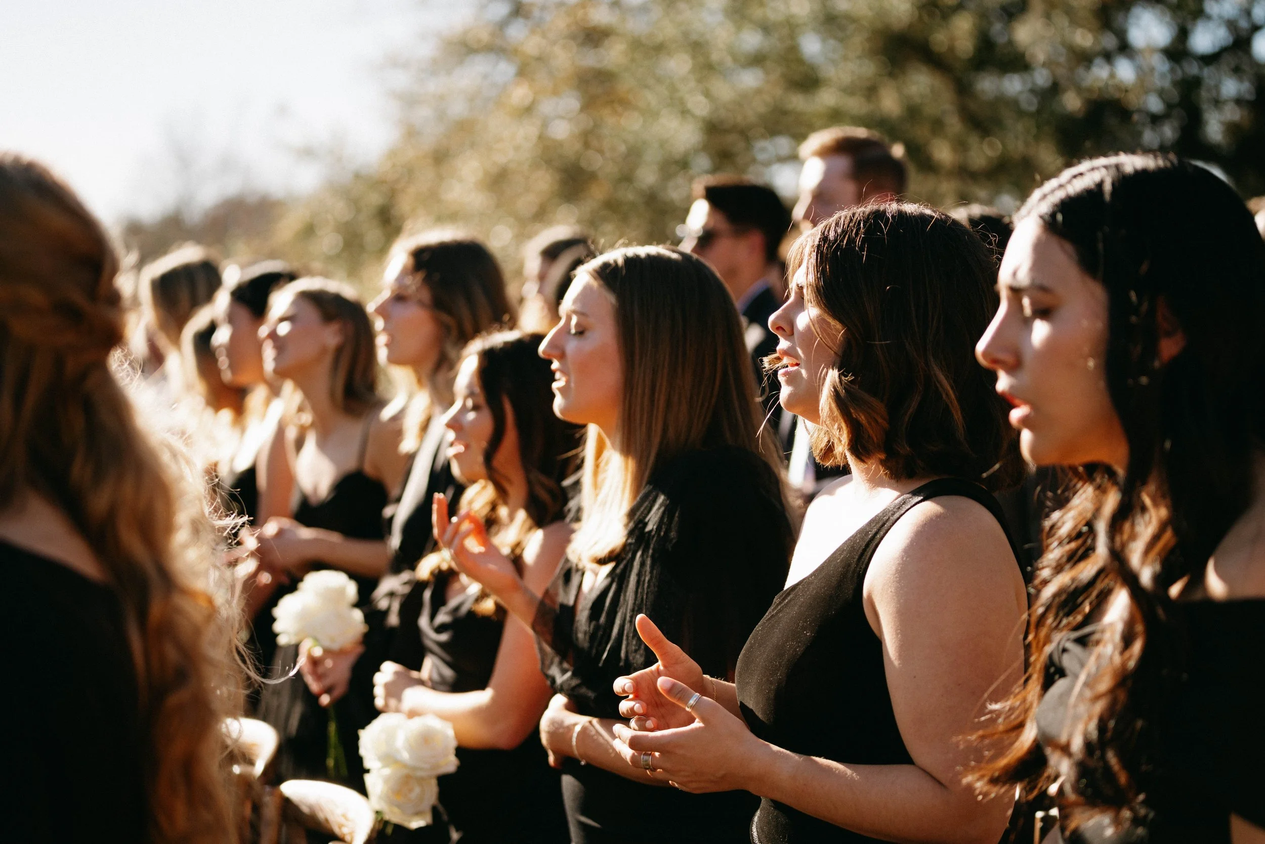 Wedding guests enjoying a Houston Oaks outdoor ceremony.