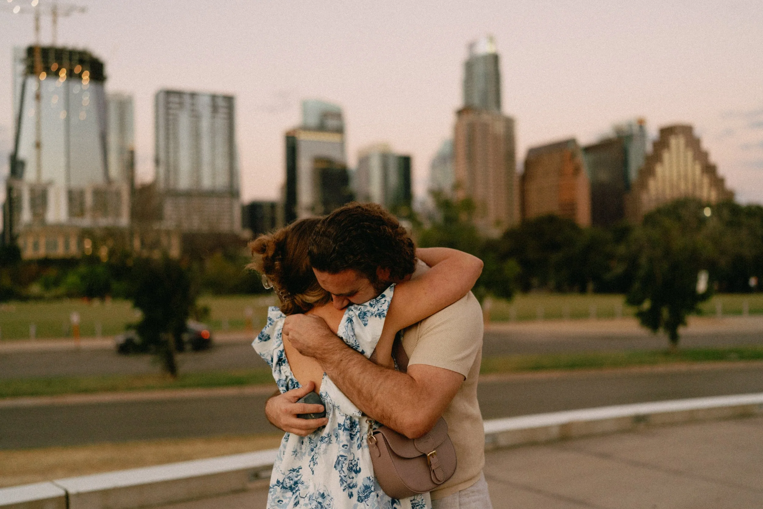 Sunset proposal at Auditorium Shores in Austin captured by documentary style wedding photographer