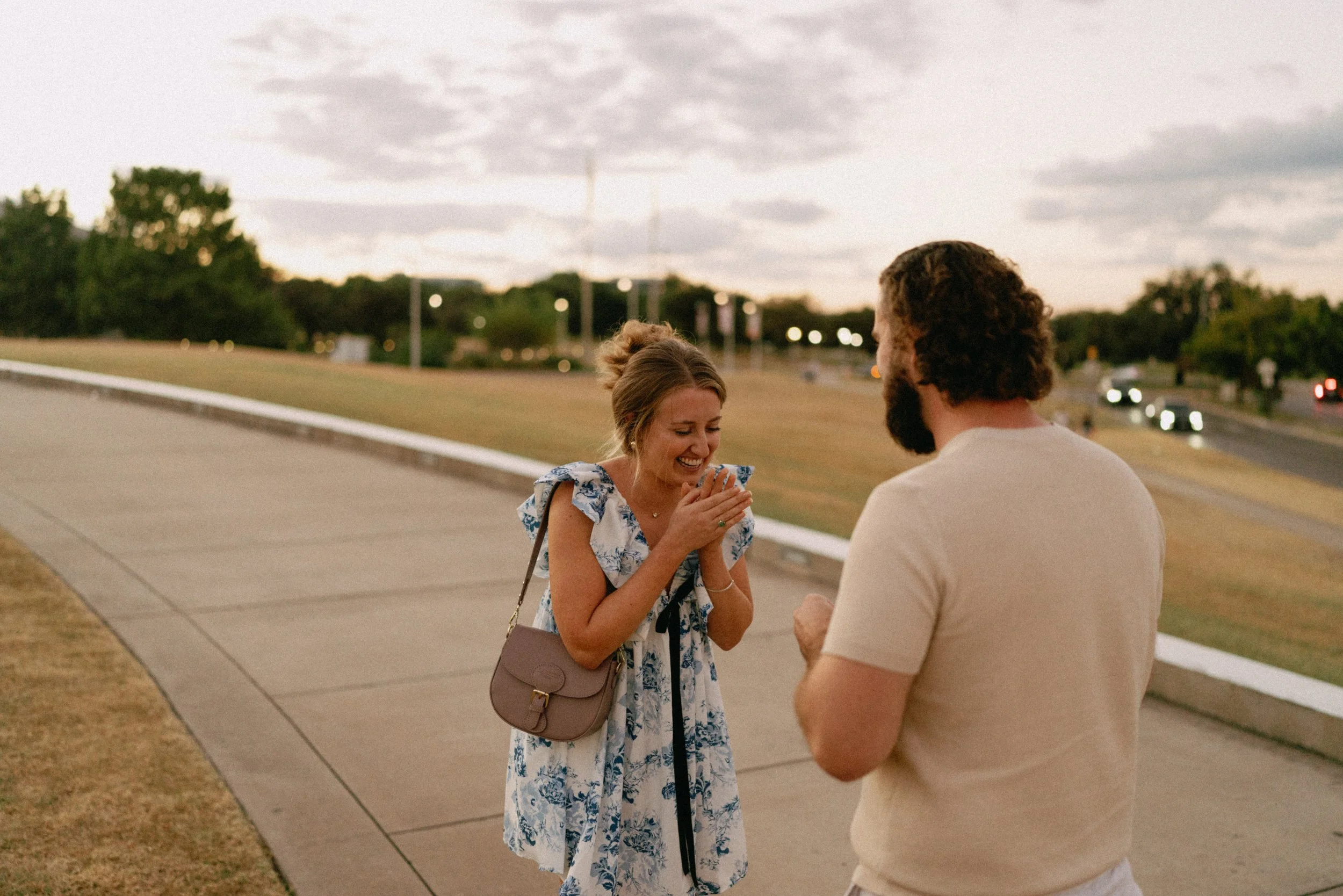Sunset proposal at Auditorium Shores in Austin captured by documentary style wedding photographer