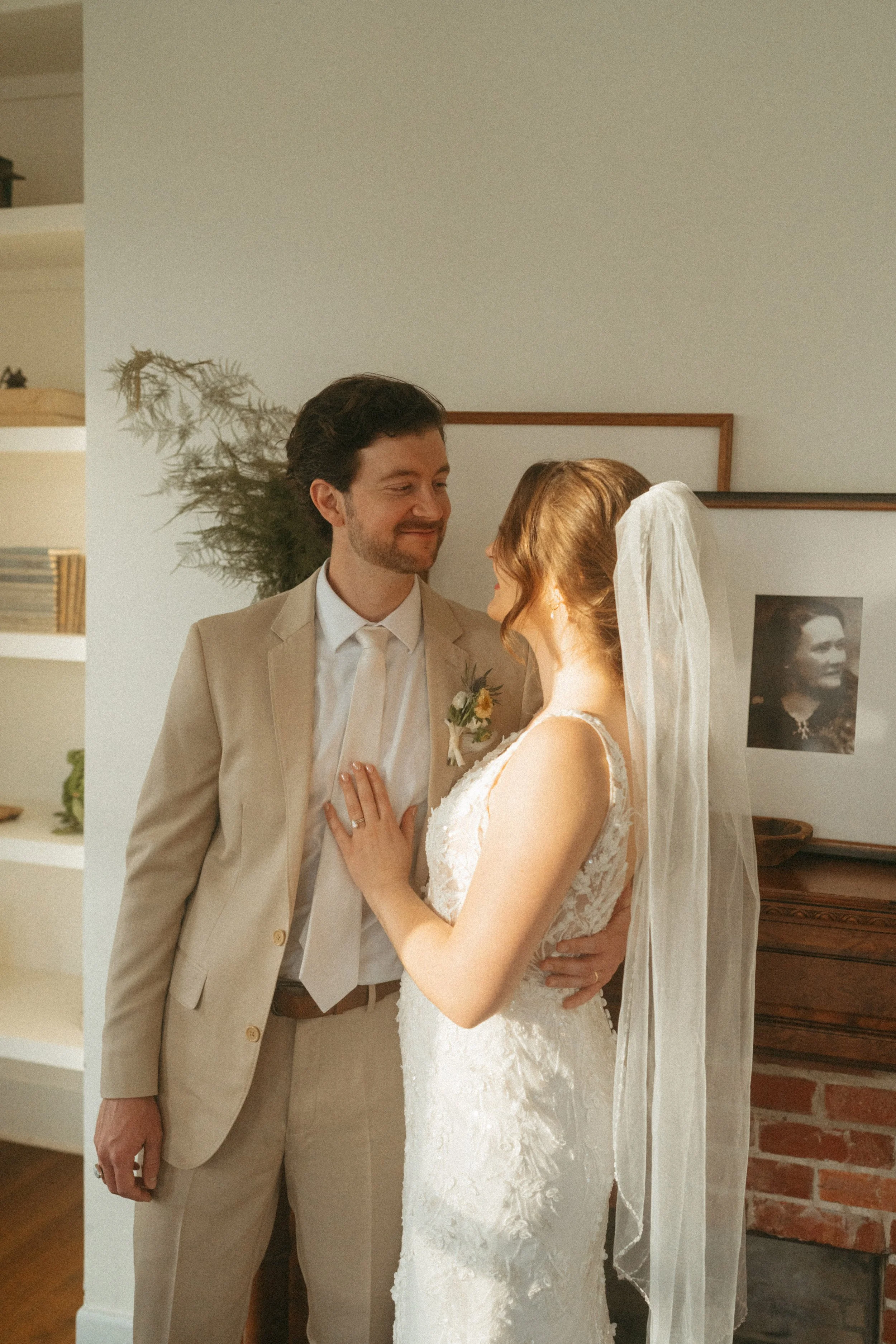 Bride and groom sunset session candid in The Grand Lady historic mansion