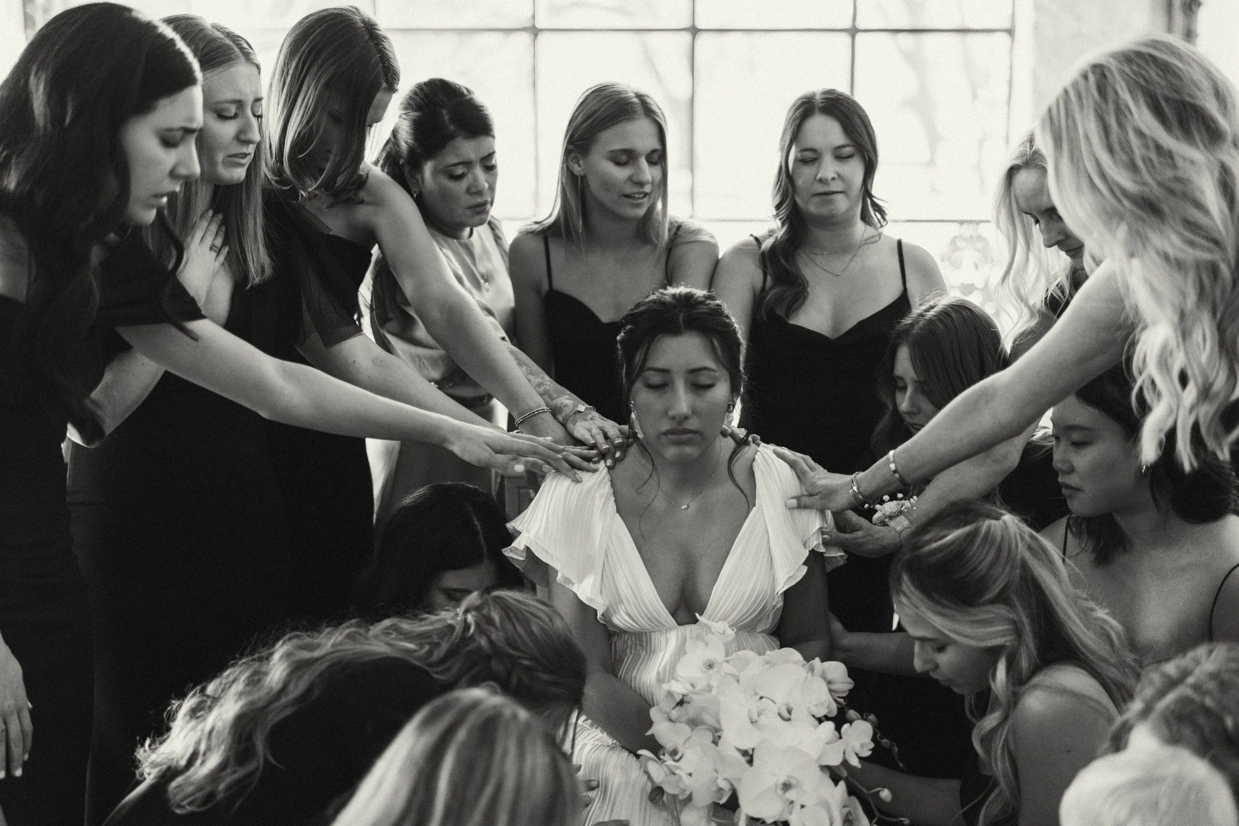 Bride sharing an emotional first look with her bridesmaids at Houston Oaks | documentary Austin travel wedding photographer.