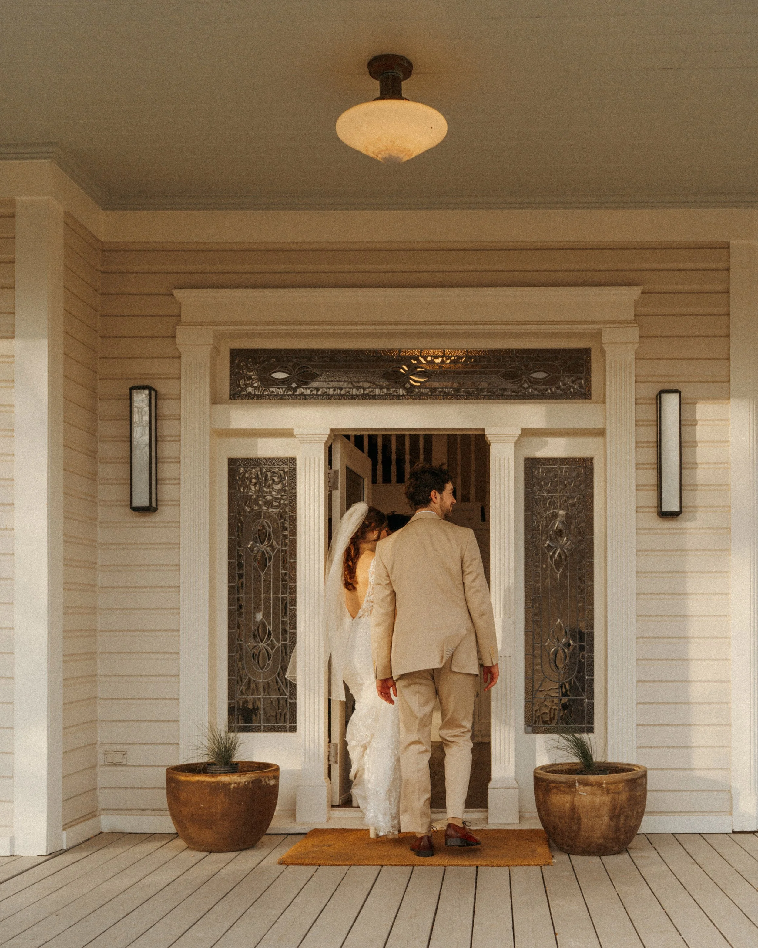 Sunset couple portrait by the mansion at The Grand Lady Austin wedding venue