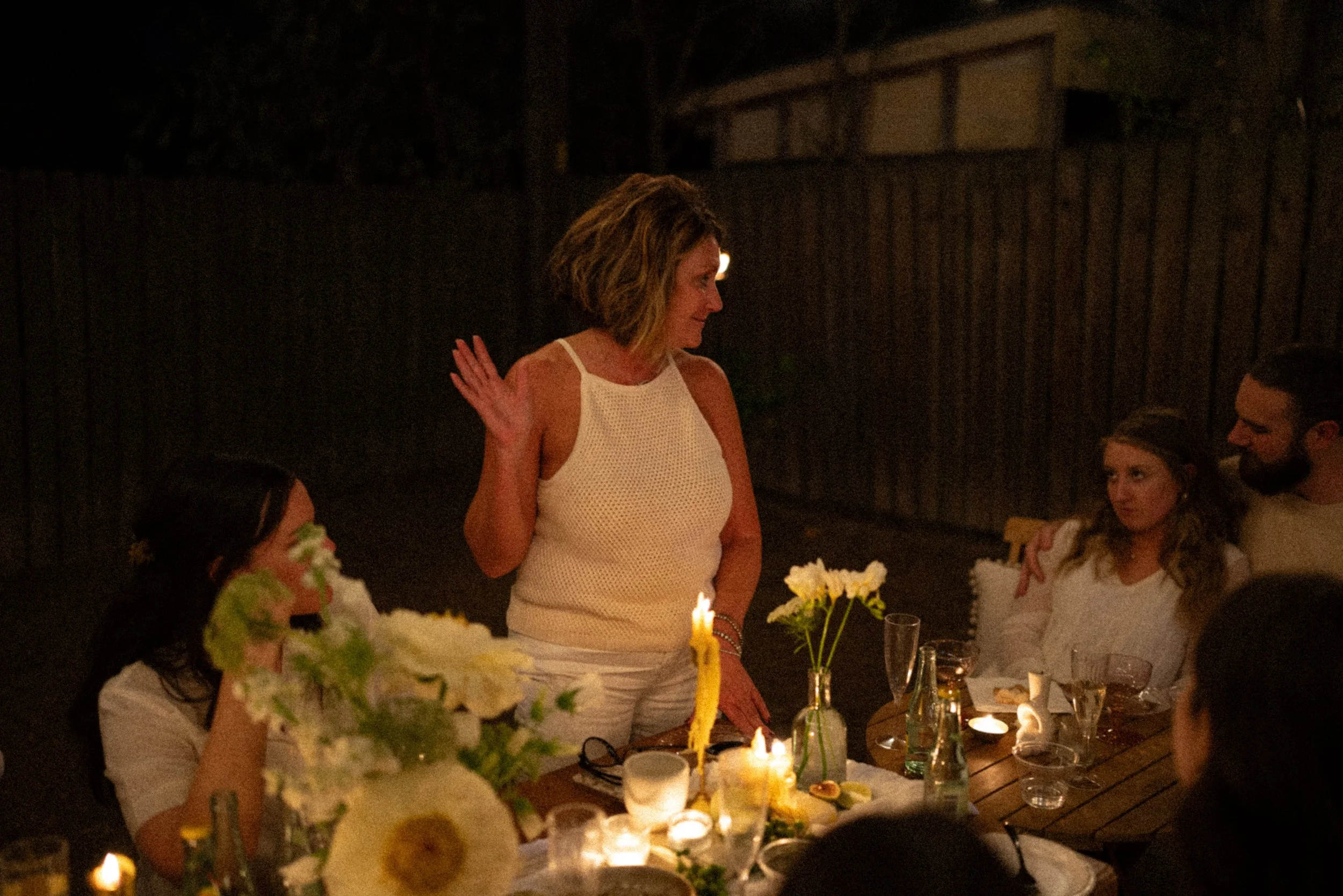 Austin wedding photographer capturing heartfelt speeches at engagement party