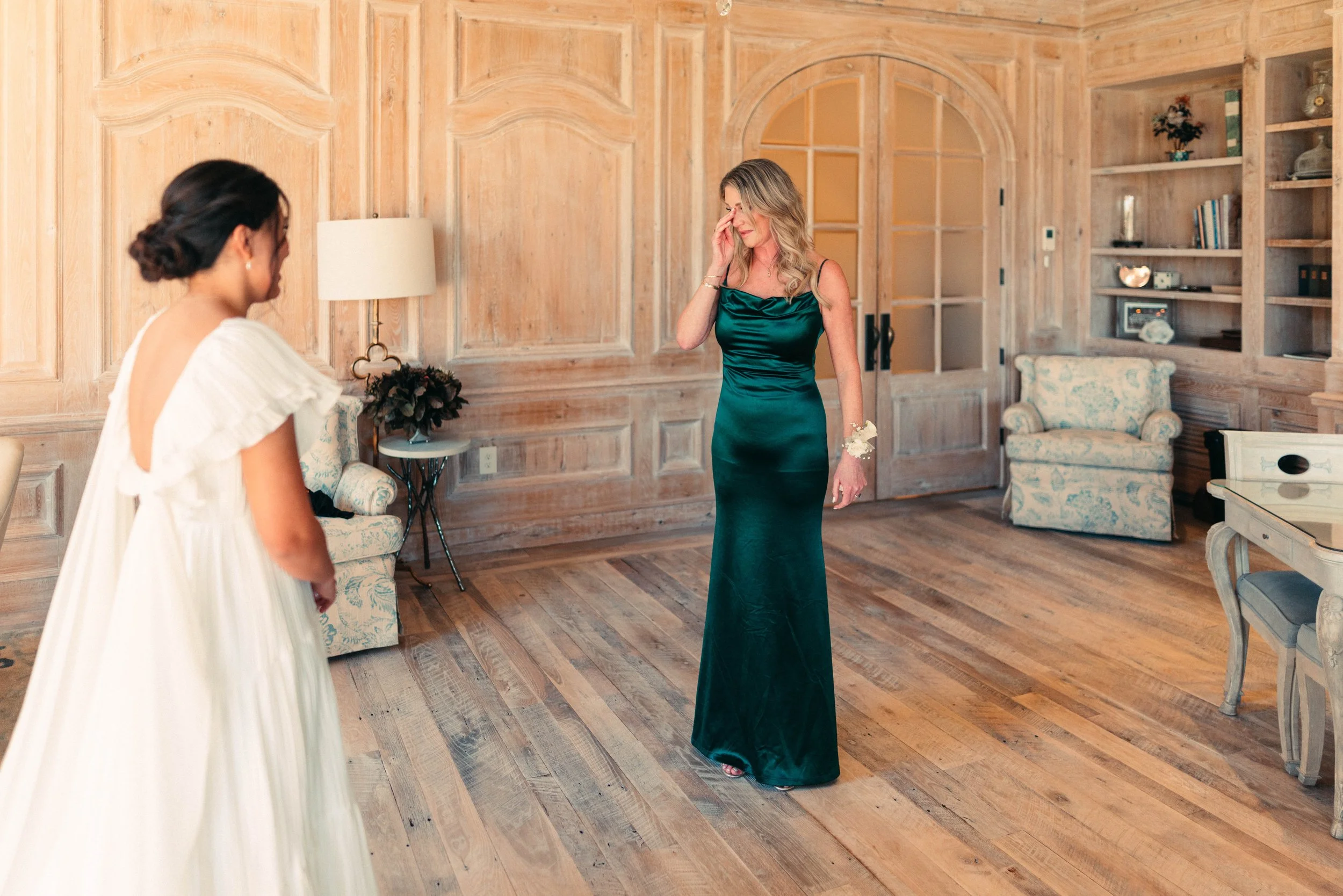 Bride sharing an emotional first look with her bridesmaids at Houston Oaks | documentary Austin travel wedding photographer.