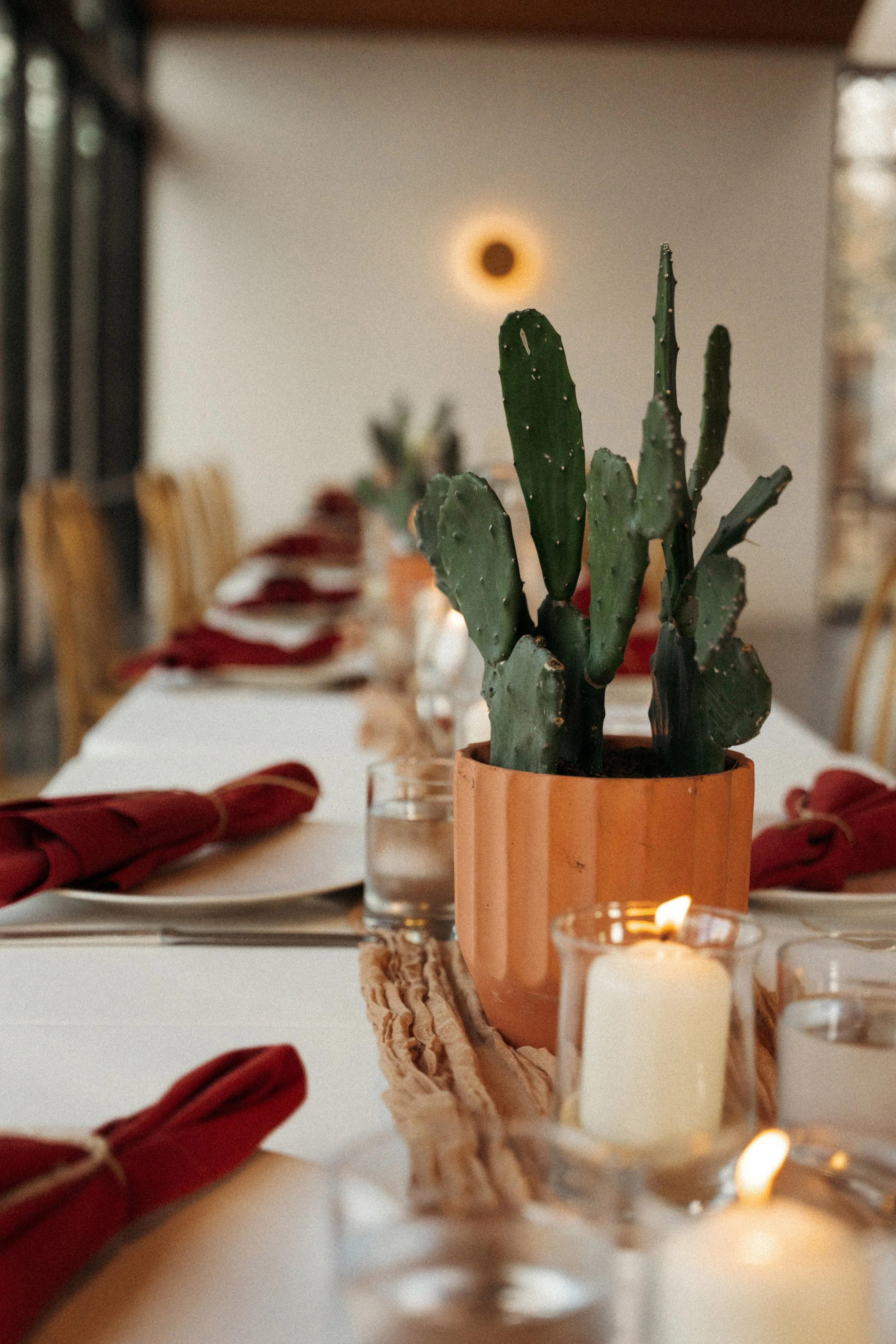 desert inspired floral centerpiece and candles at The Grand Lady wedding reception hall