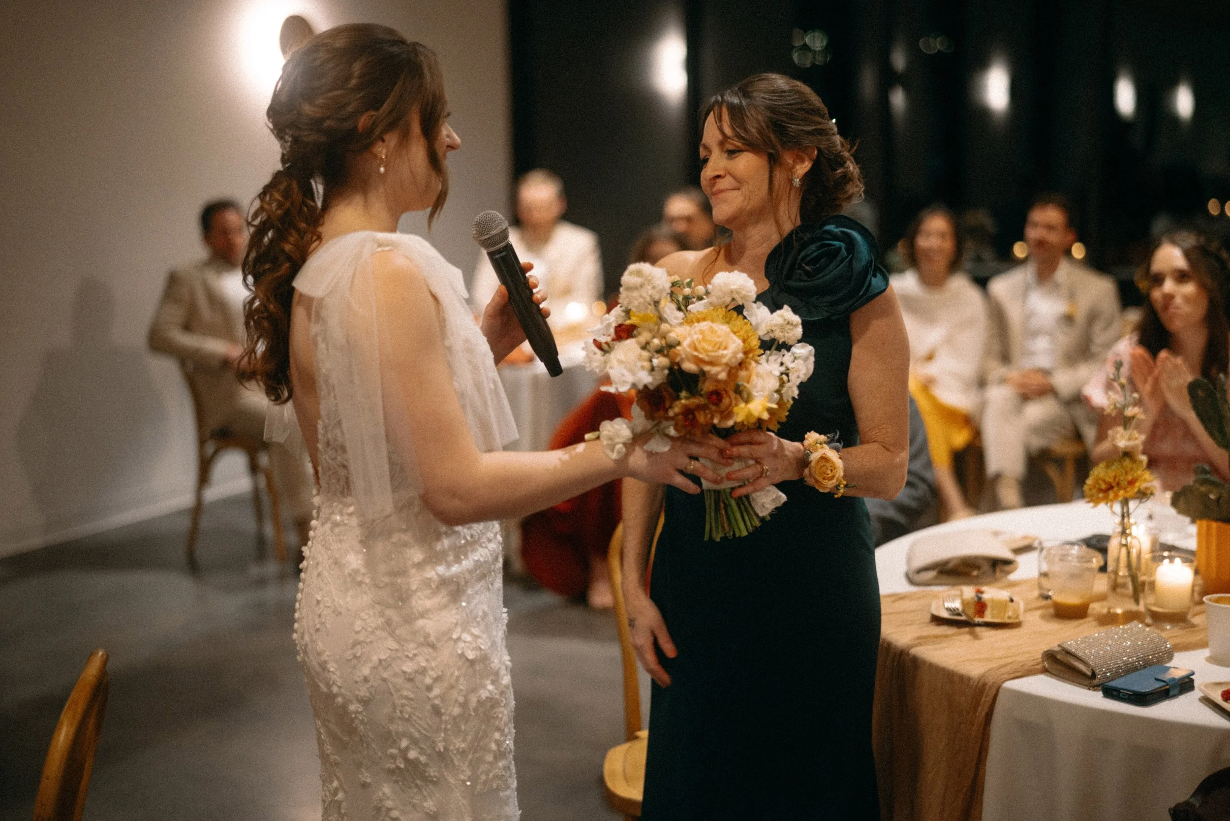Bride dedicates bouquet to her mother during wedding reception at The Grand Lady Manor TX