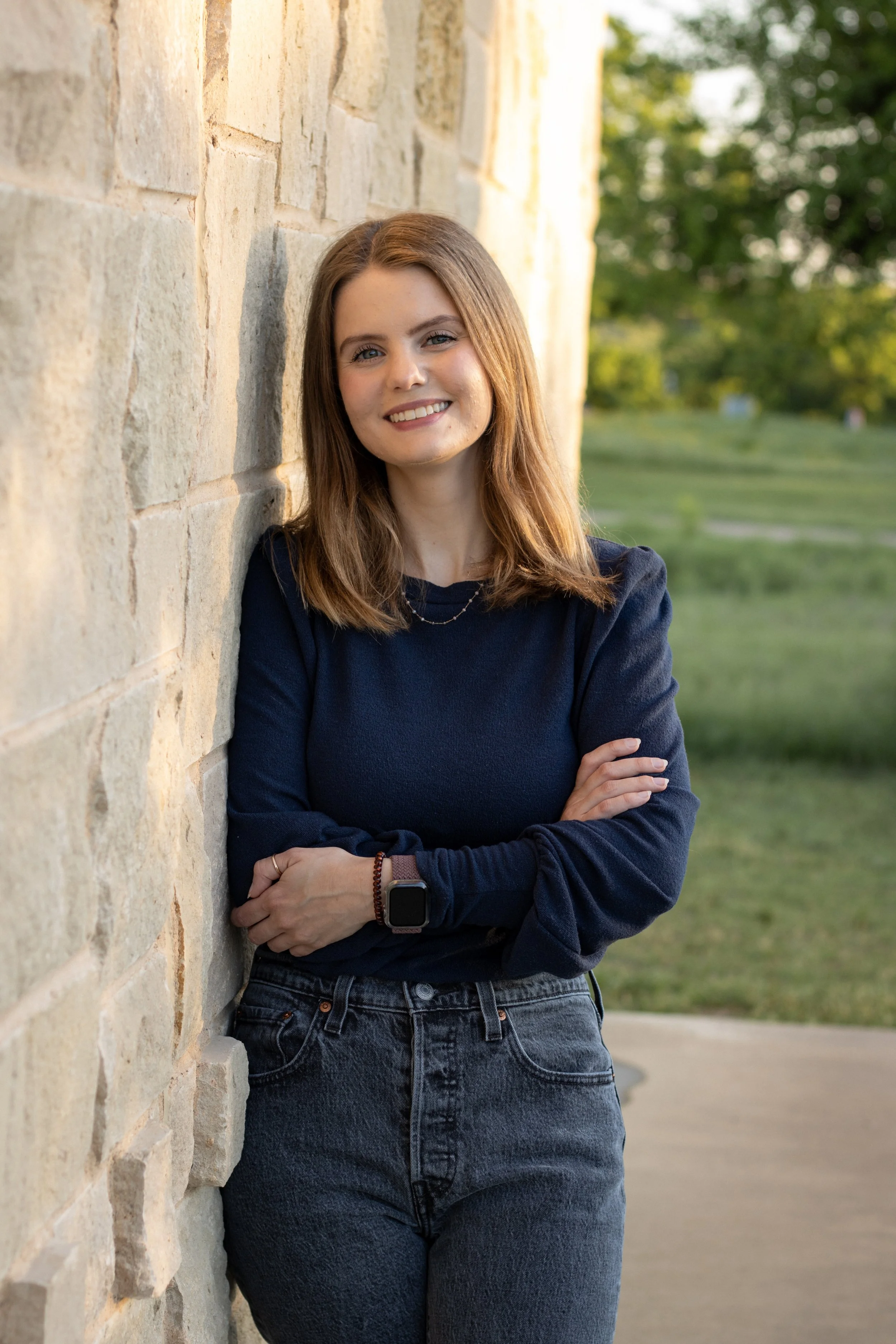 Hannah Bjerke Registered Dietitian Nutritionist Headshot Standing Against a Brick Wall