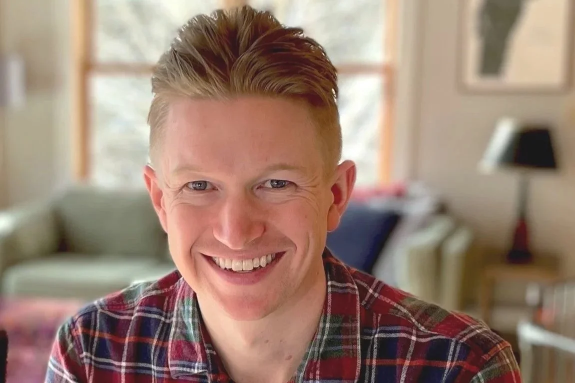 Andrew Herwig on a video call, ready to connect with new coaching clients.