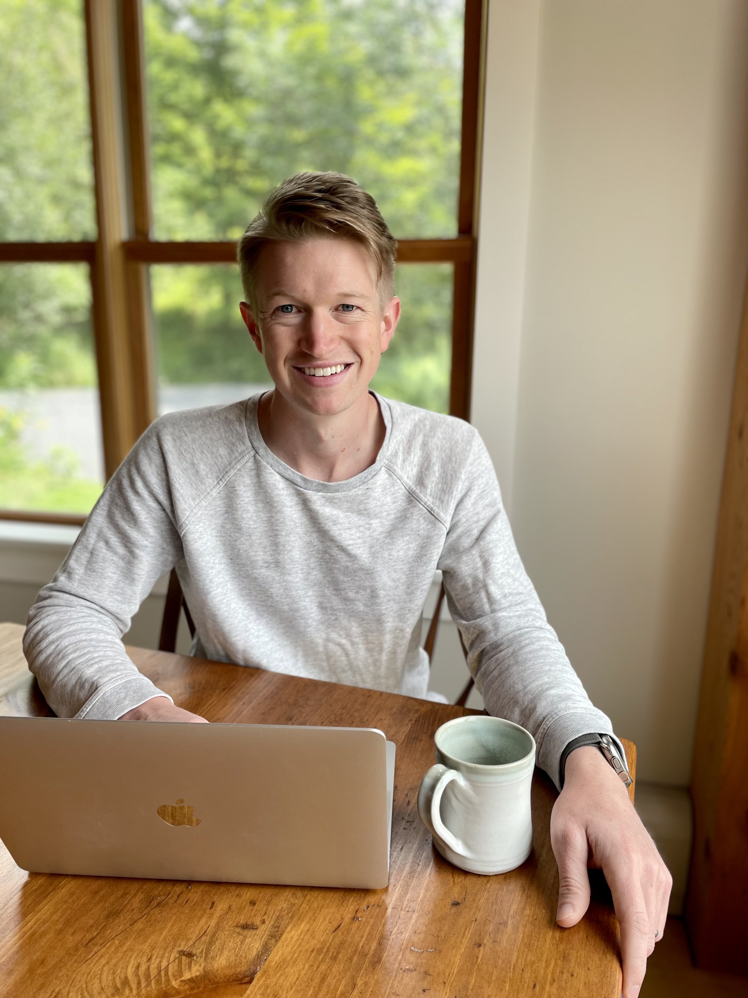 Andrew Herwig smiling, financial and business coach at Spend With Clarity