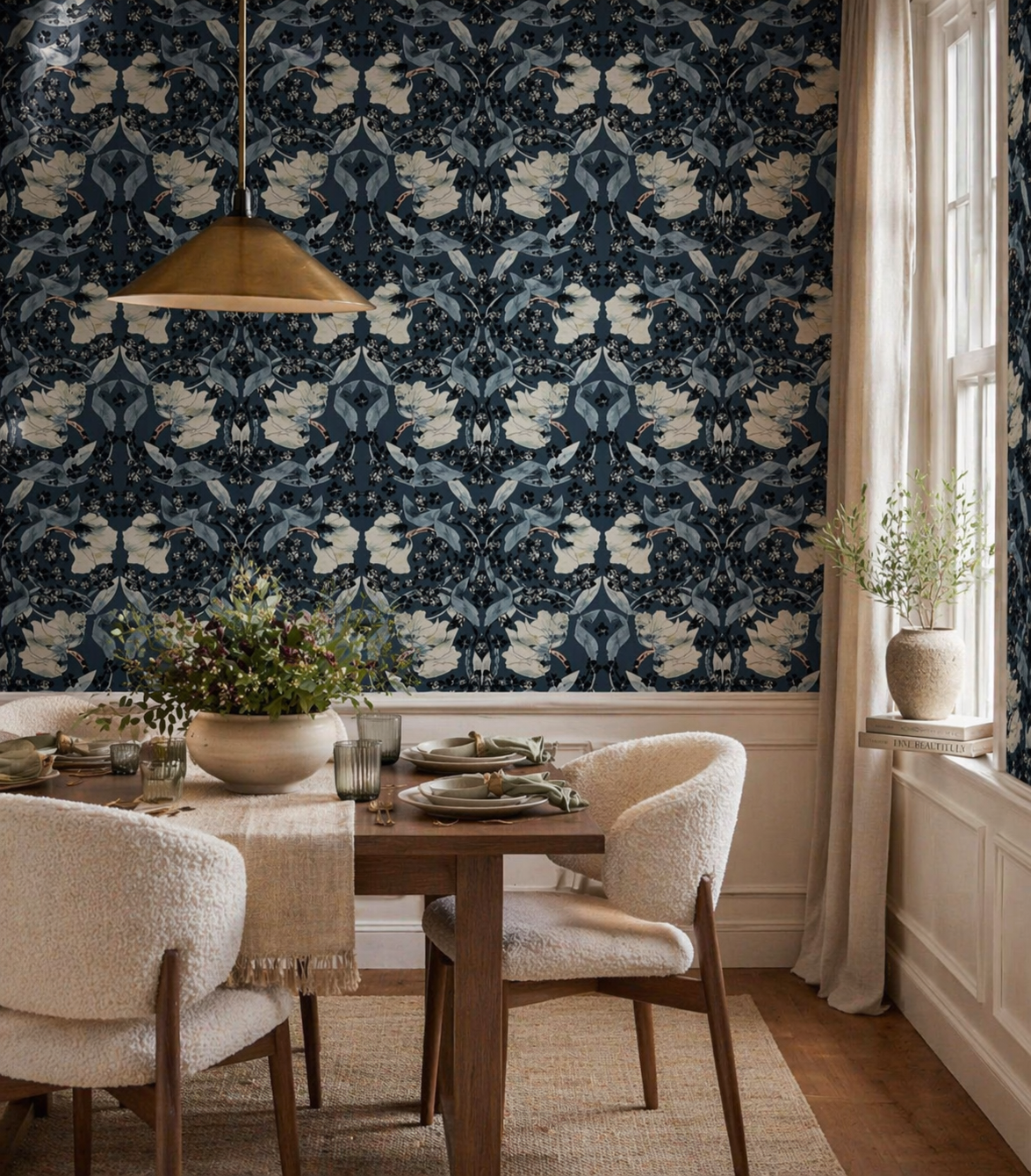 Dining room with a wooden table, beige chairs, patterned wallpaper with dark blue, gray, and white floral design, and a window letting in natural light.