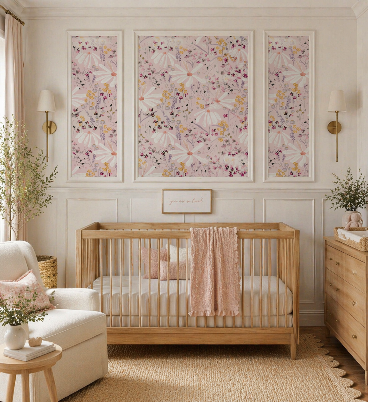 A cozy, softly decorated bedroom with a white bed featuring ruffled bedding and a teddy bear. The room has floral wallpaper with daisies and blue flowers, a white dresser with framed photos and a vase of white flowers, and a clothing rack with pastel-colored dresses and a straw hat. There's a wicker basket with a yellow blanket and a pair of light blue shoes beside the bed.