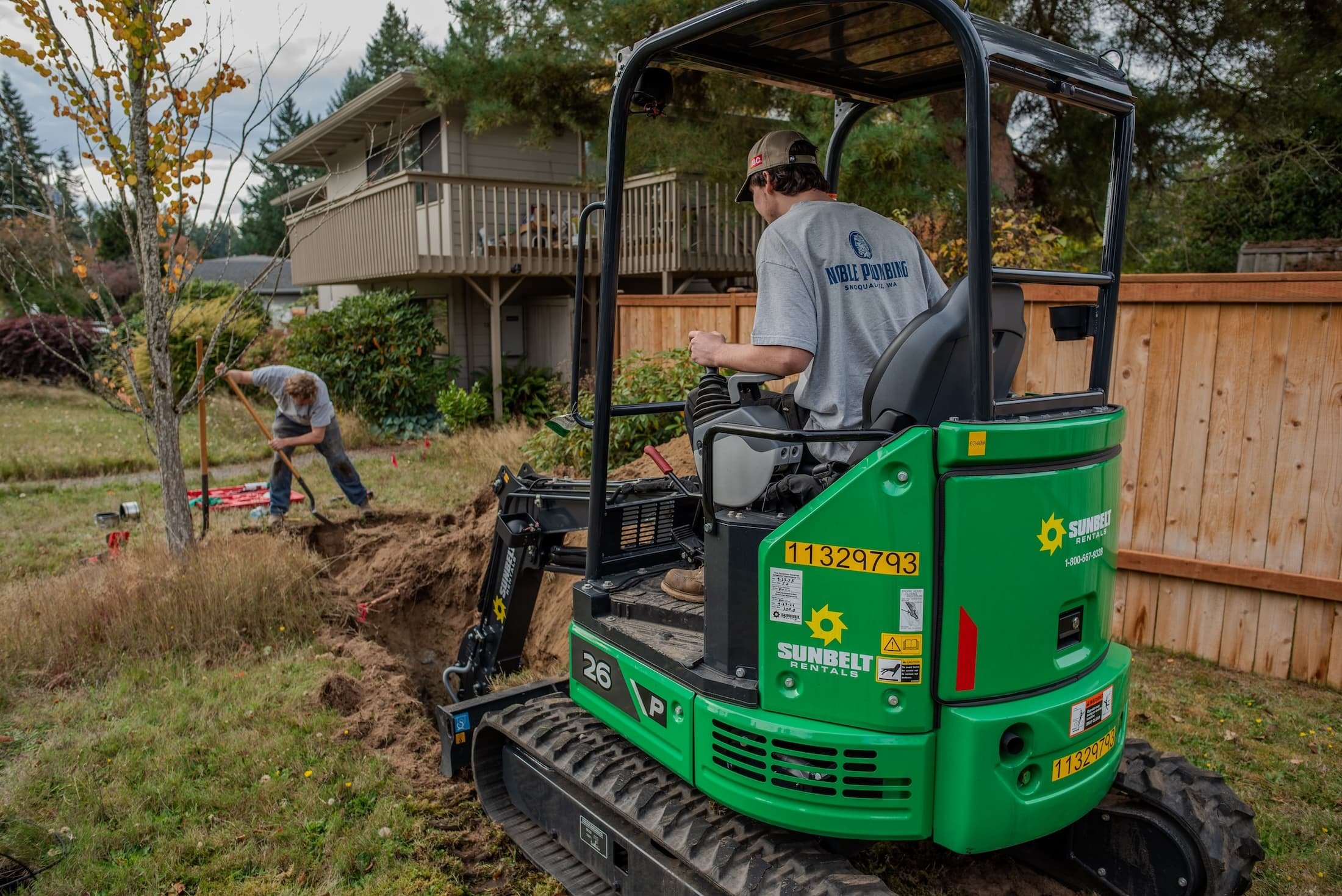 Noble worker uses machinery to access sewer line for repair.
