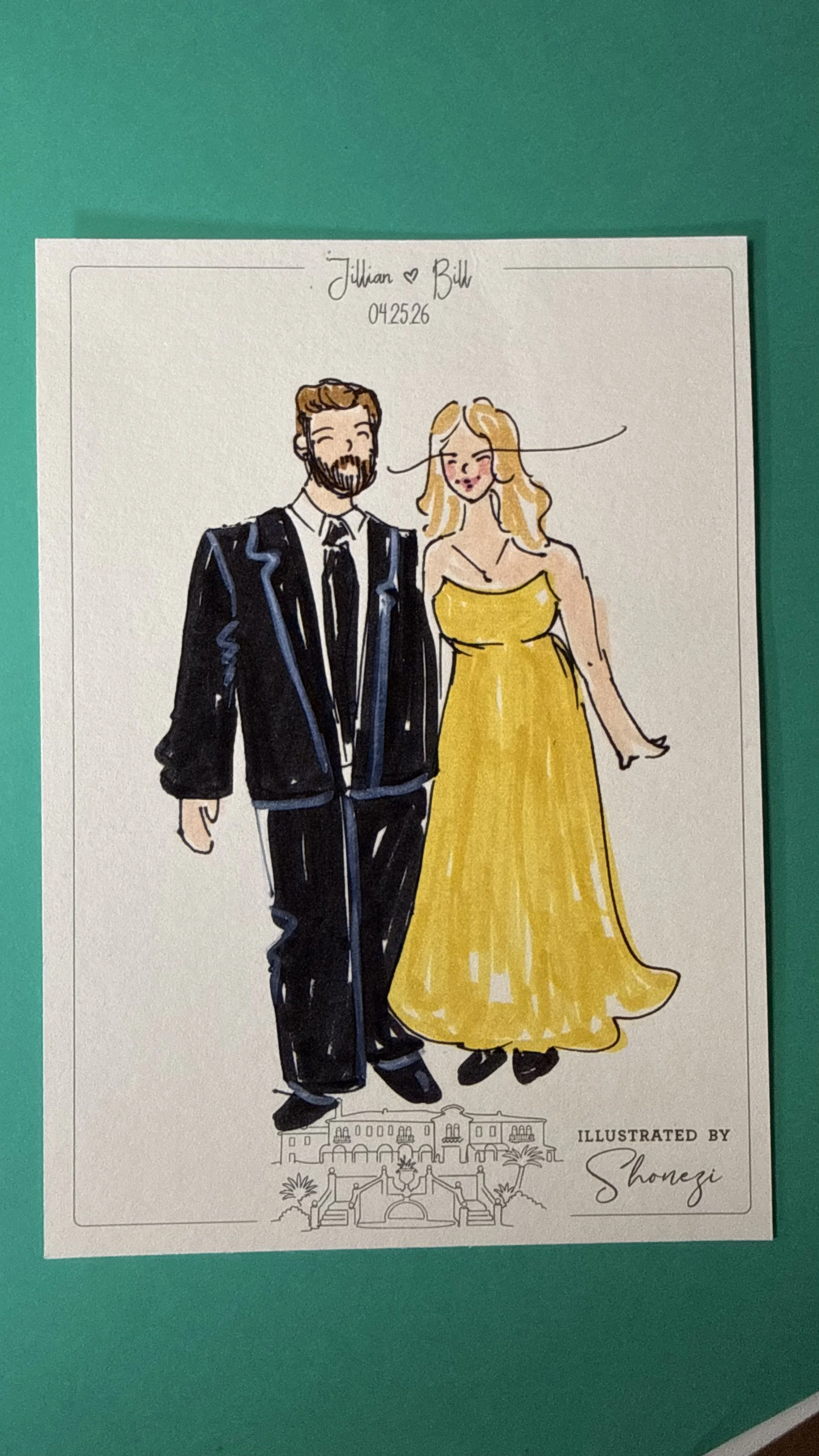 A colorful illustration of a smiling man in a black tuxedo and a smiling woman in a yellow gown standing close together. The illustration is signed by Shonezi, and there is a drawing of a building with palm trees at the bottom.
