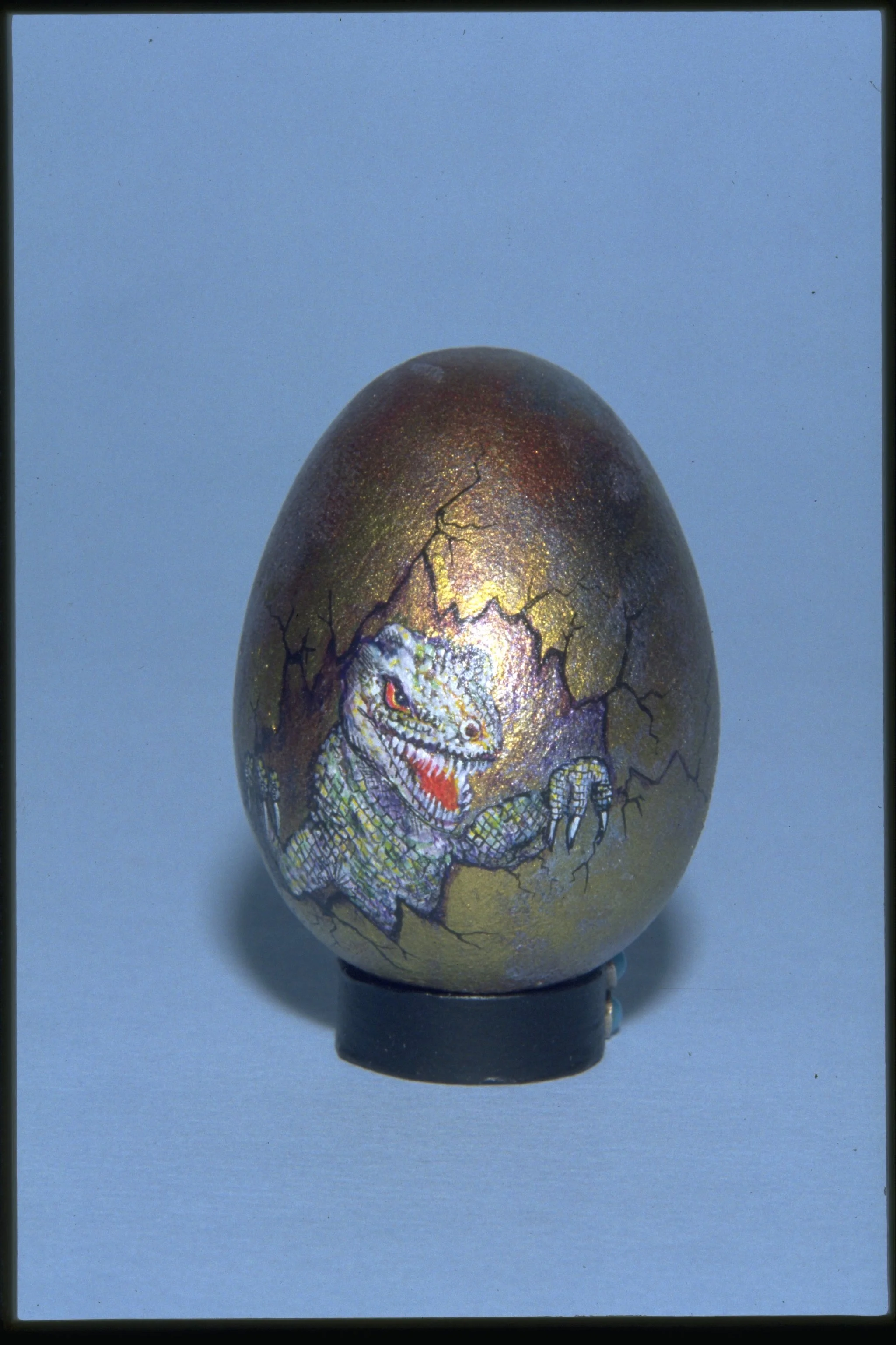 DINOSAUR HATCHLING - Lathed wood/Pigment - Quail sized egg - Gold infused pigment for background