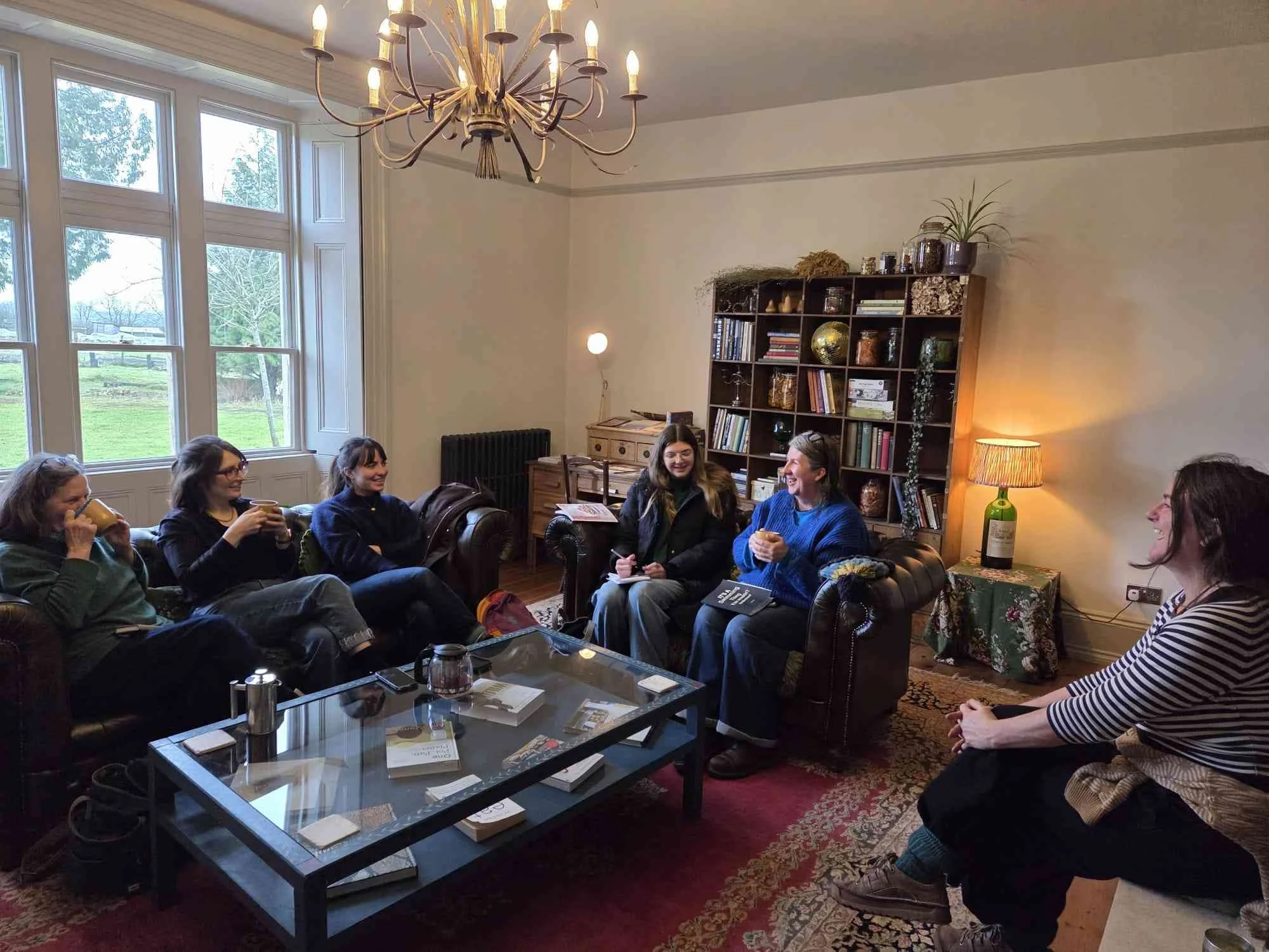 resized group of women on sofas at Vallis.jpg
