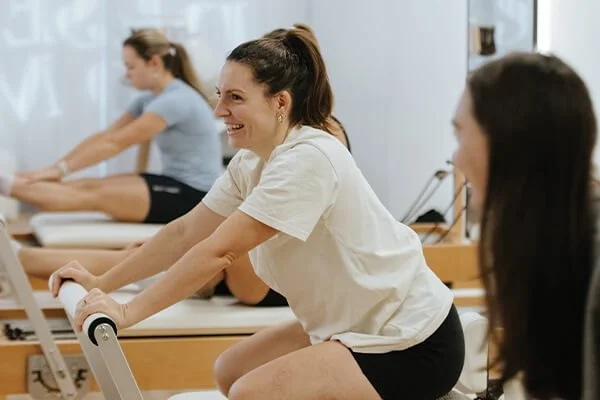 Group of women attending a beginner reformer pilates class in Noosa