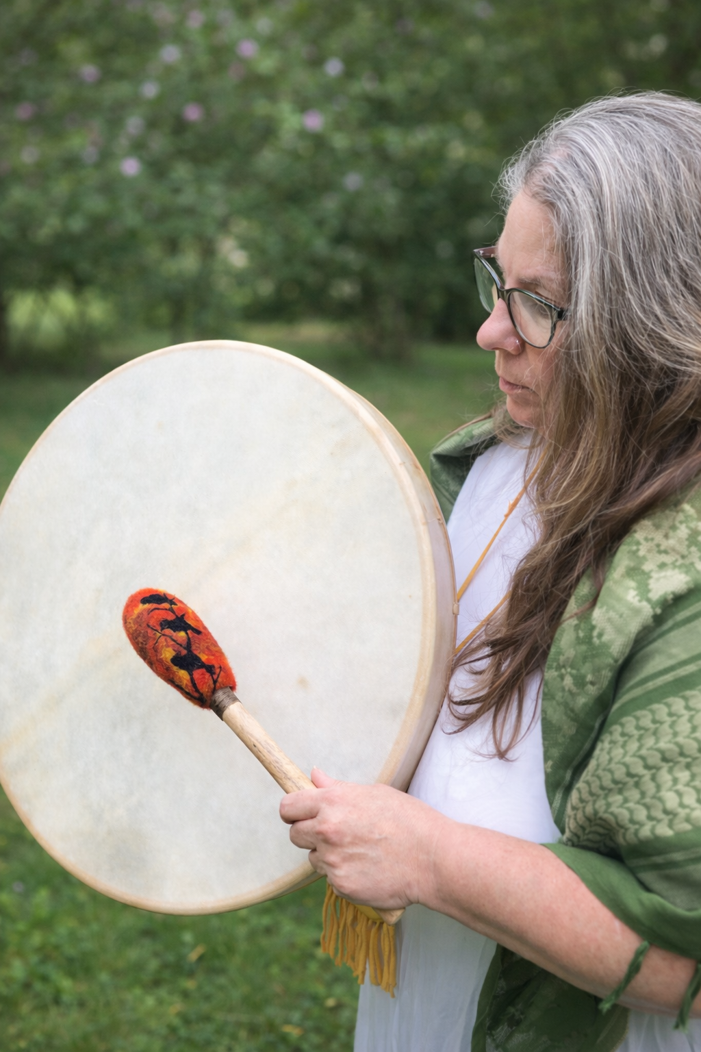 Woman with drum in garden