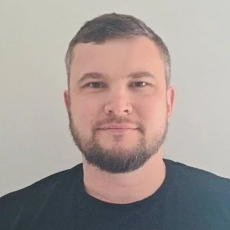 schologists psychology tutor holding mug outside in front of quote saying learn from yesterday live for today hope for tomorrow