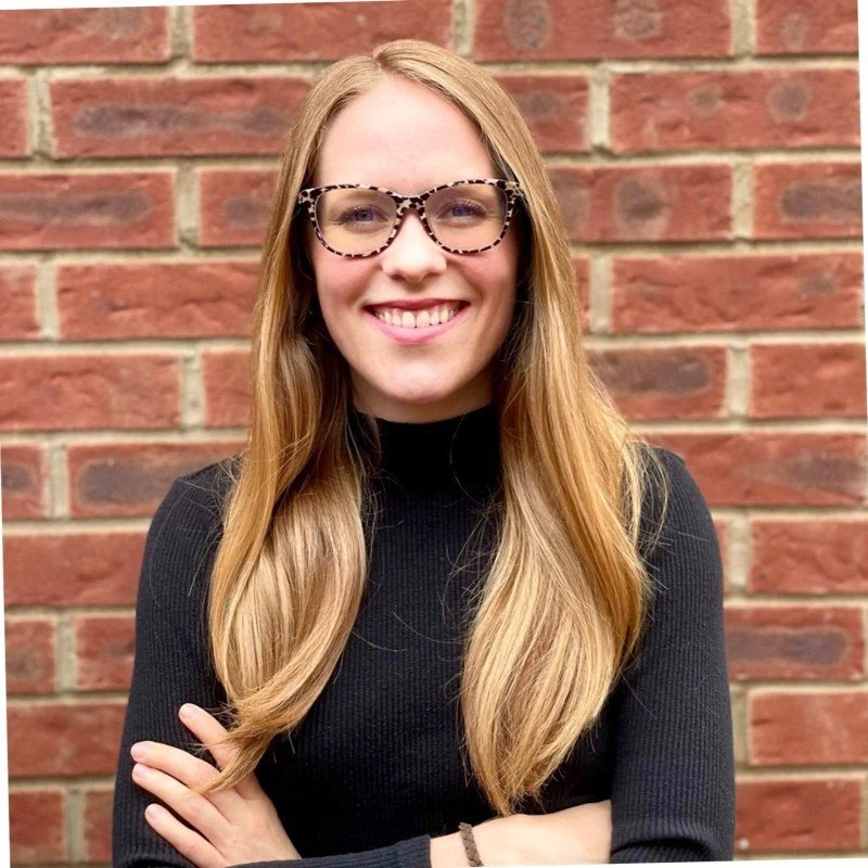 schologists creative director wearing black shirt with beard