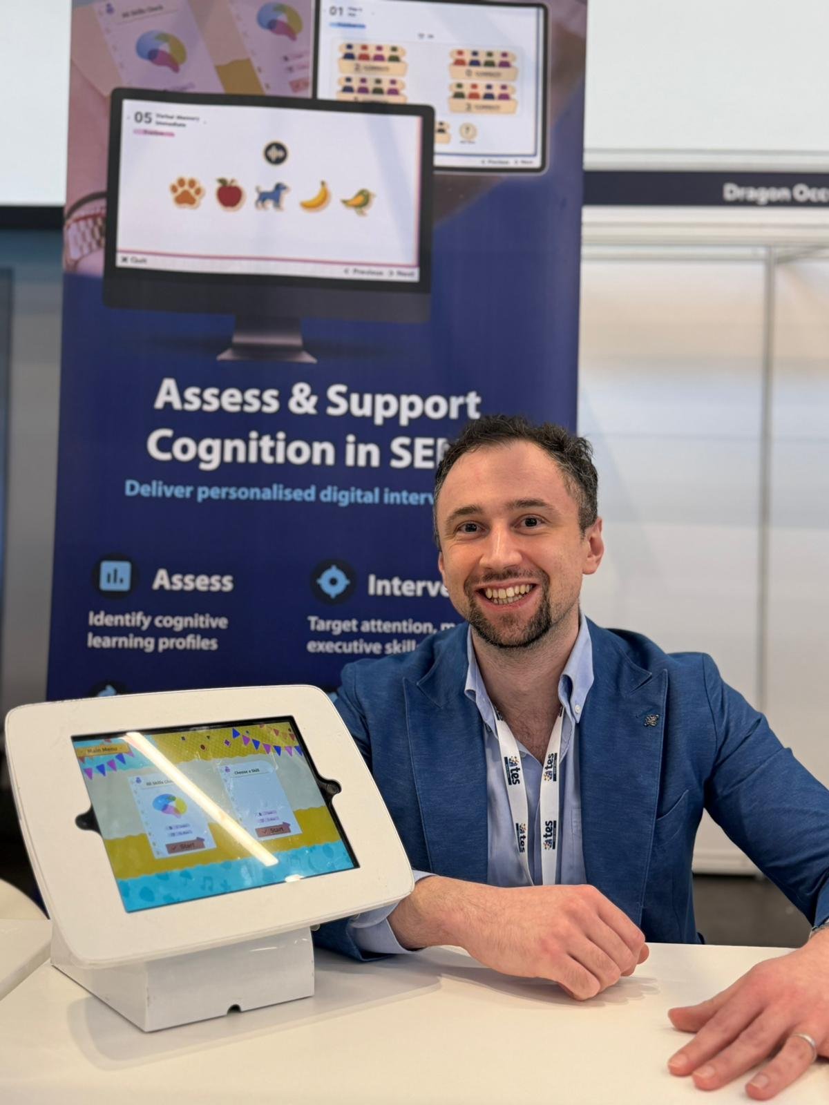 schologists psychology tutor sam swidzinski talking to student in ergonomic chair with plant in background