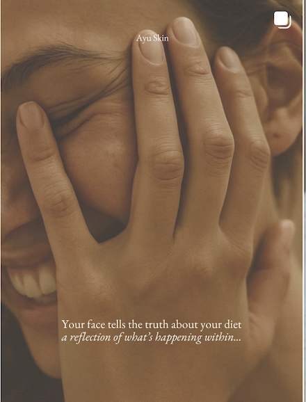 Close-up of a person's face partially covered by their hand, smiling, with text overlay about face reflecting inner feelings.