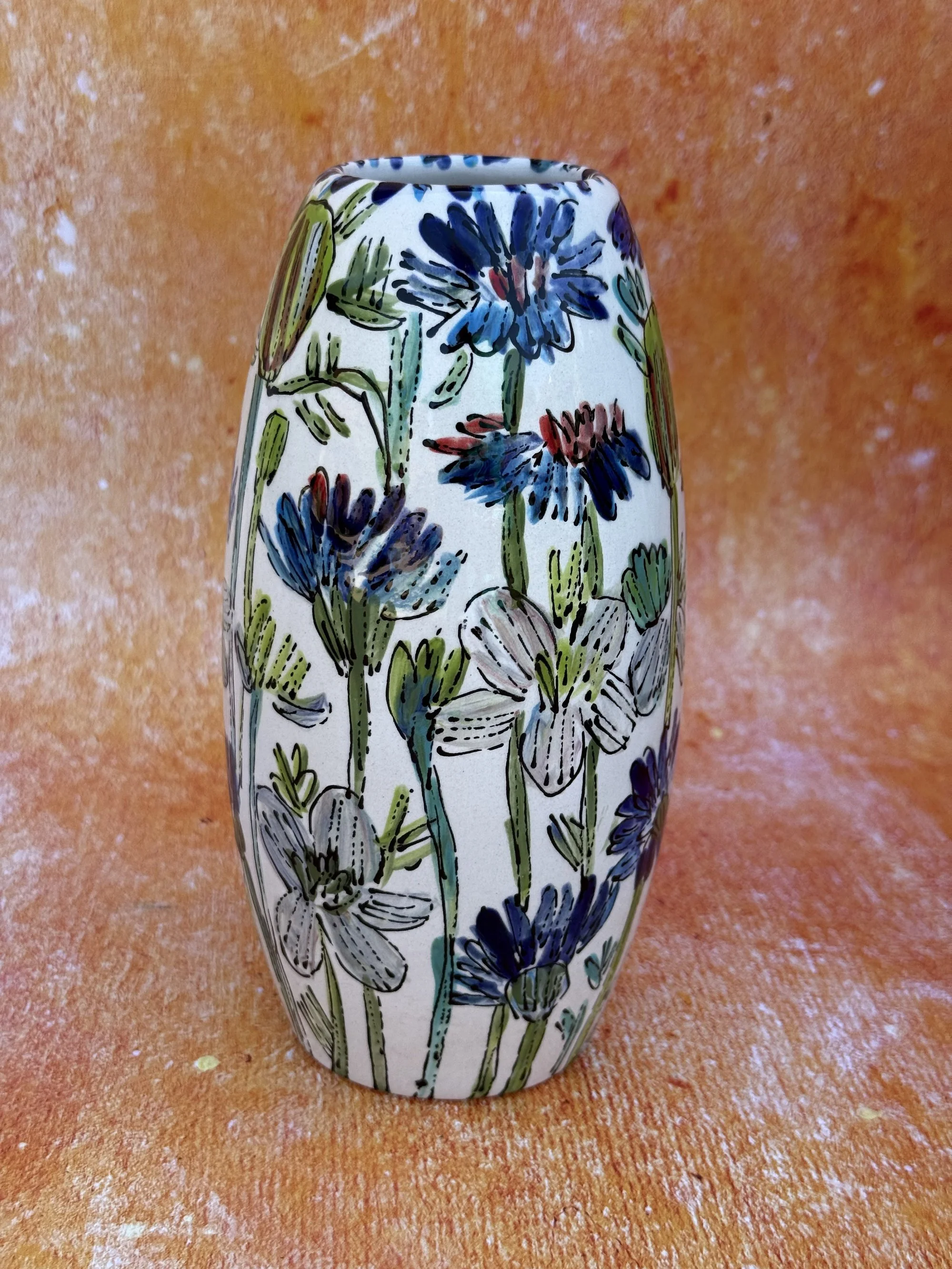 Flowers on White Torpedo Vase