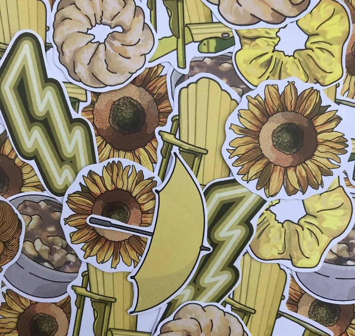 pile of yellow assorted pgoodsfineart stickers