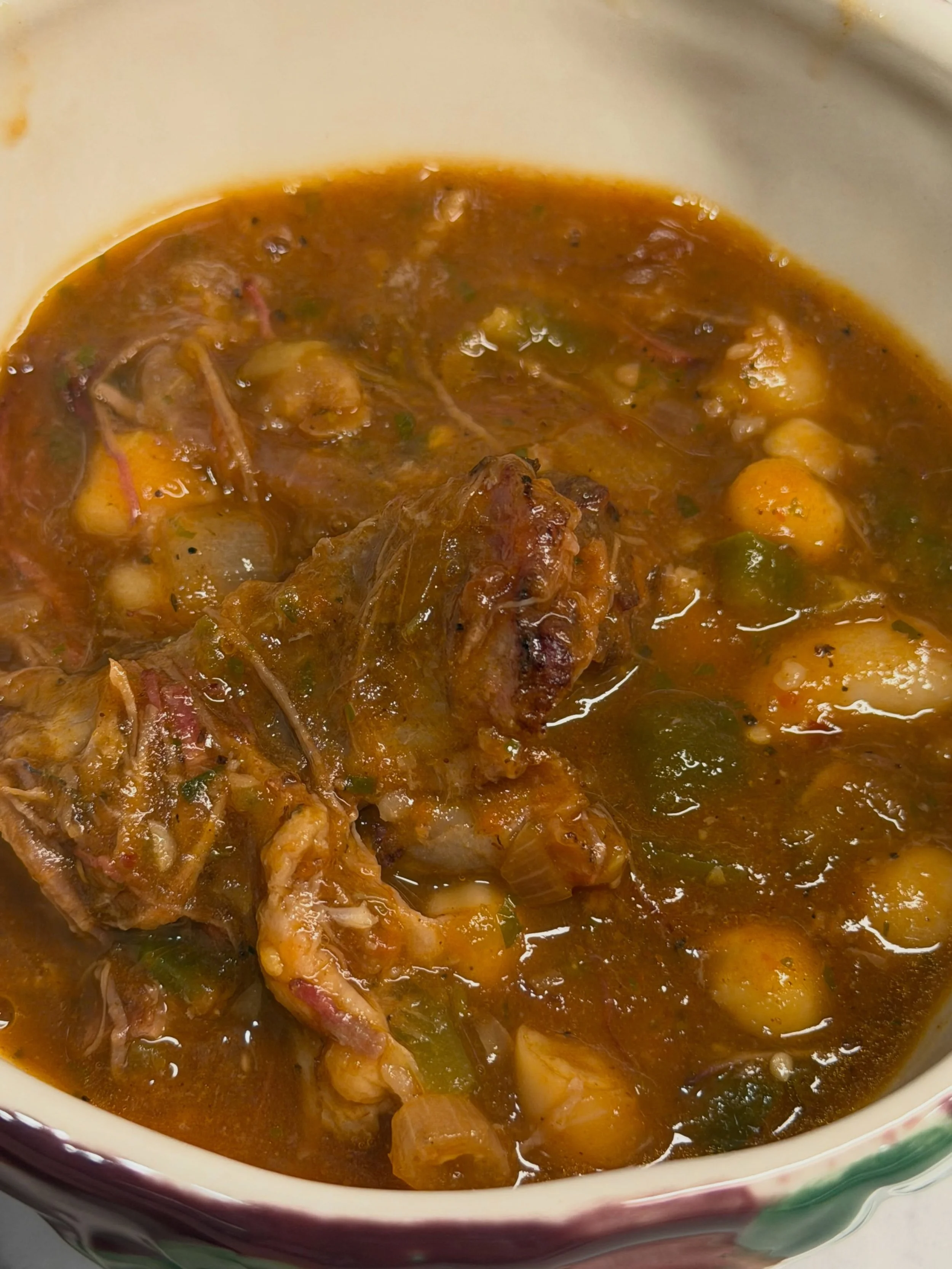 It was a leftovers masterpiece. 
1 red onion diced
1 white onion diced
2 jalape&ntilde;os deseeded and diced
1 lb smoked short ribs seasoned with Sizzle
1 can of crushed tomatoes 
1 can of Garbanzo Beans rinced
1 can of navy beans rinced
2 pur&eacute