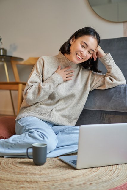 small-vecteezy_vertical-shot-of-beautiful-asian-woman-student-sitting-at_35336043_small.jpg