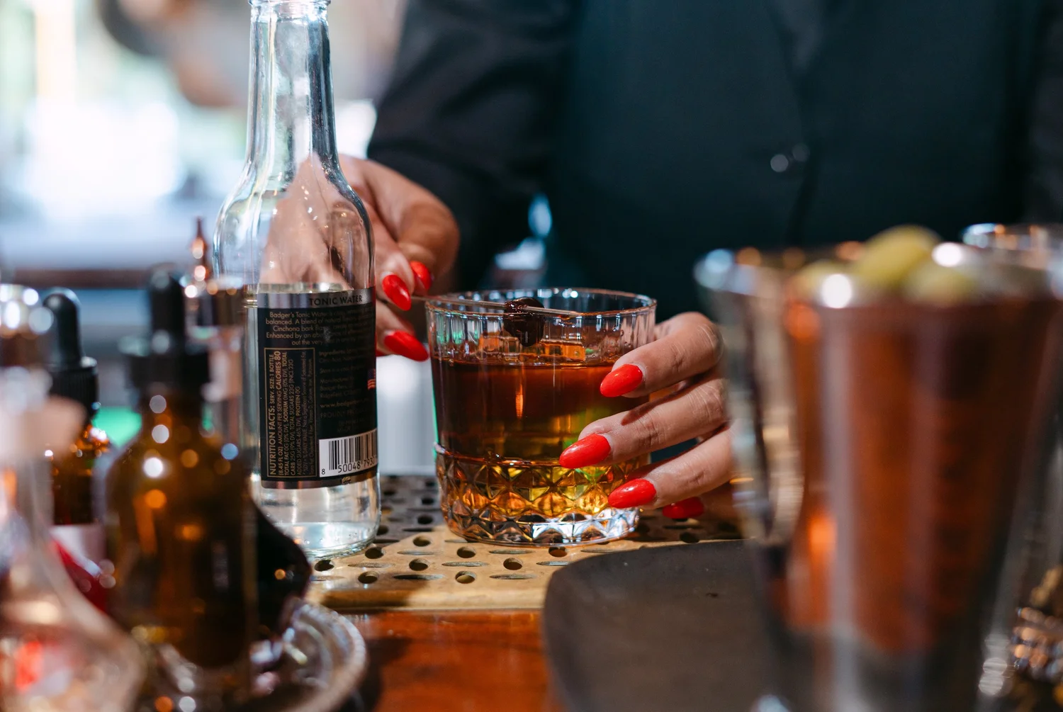 A bartender preparing cocktails at Left Door