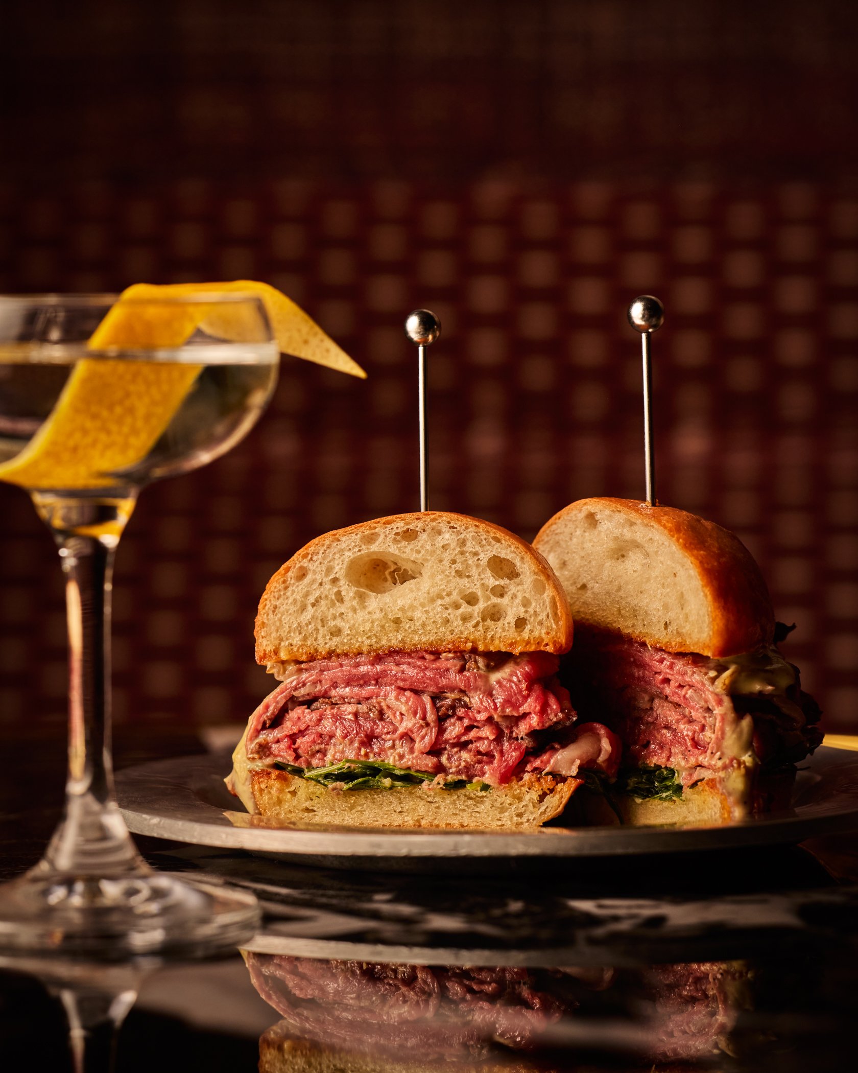 Sandwich on plate with martini glass next to it. Photo credit: Nicola Parisi